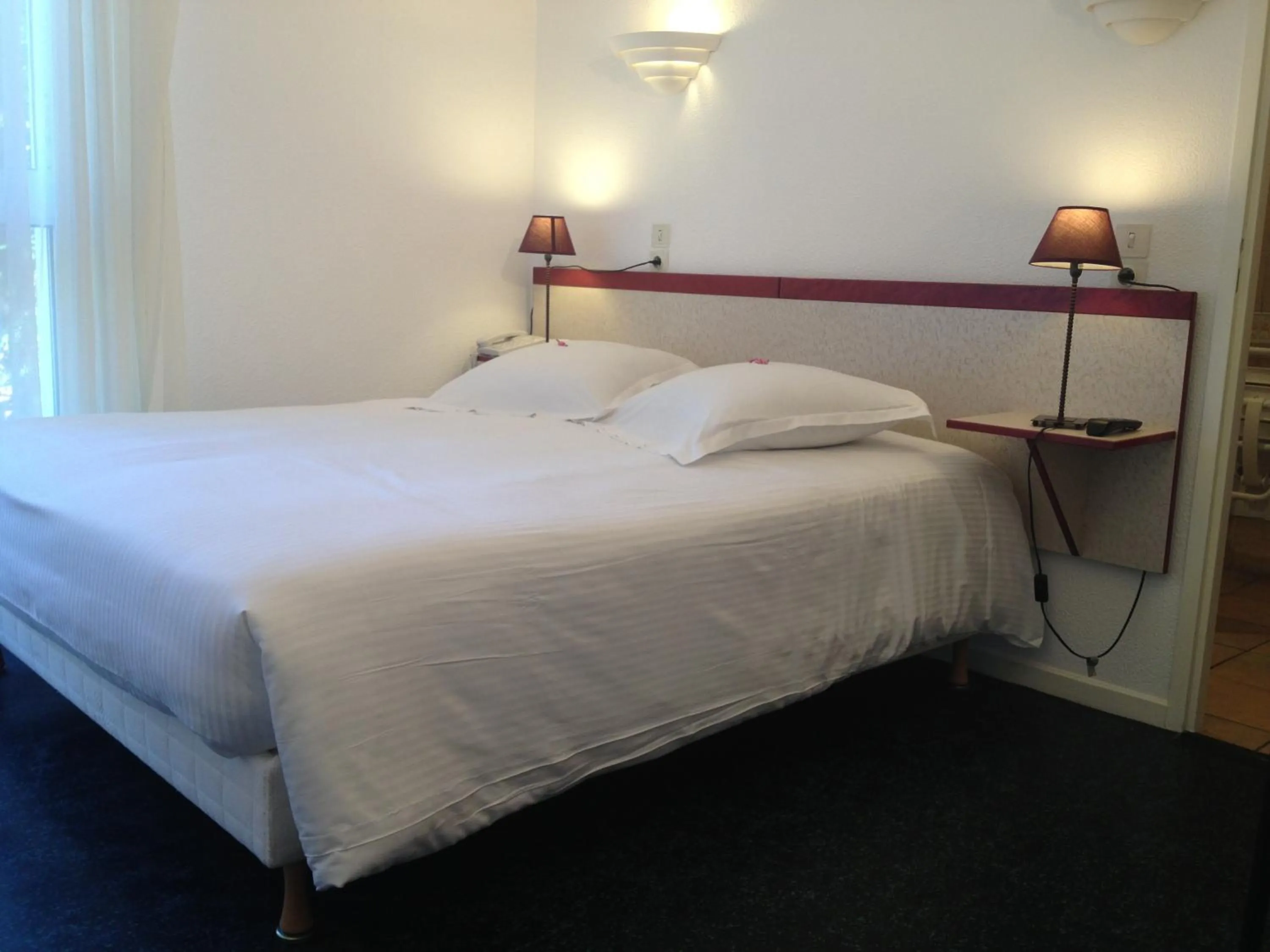 Bed in Hôtel Orange Marine