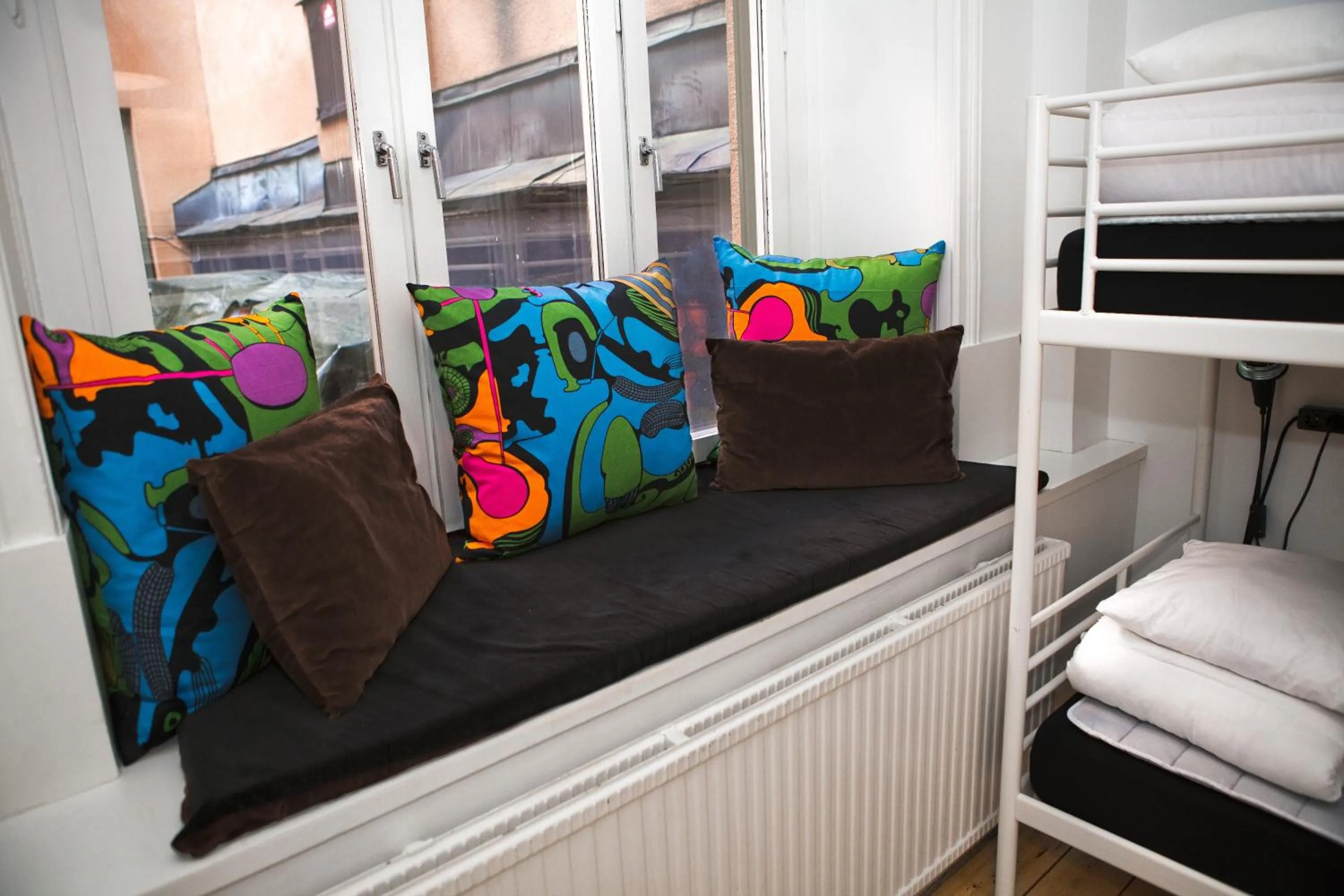 Seating area, Bed in City Backpackers Hostel