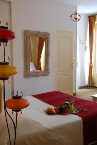 Photo of the whole room, Bed in Logis Hôtel Restaurant Les Capucins