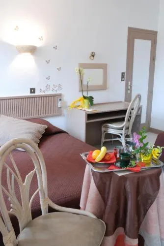 Photo of the whole room in Logis Hôtel Restaurant Les Capucins