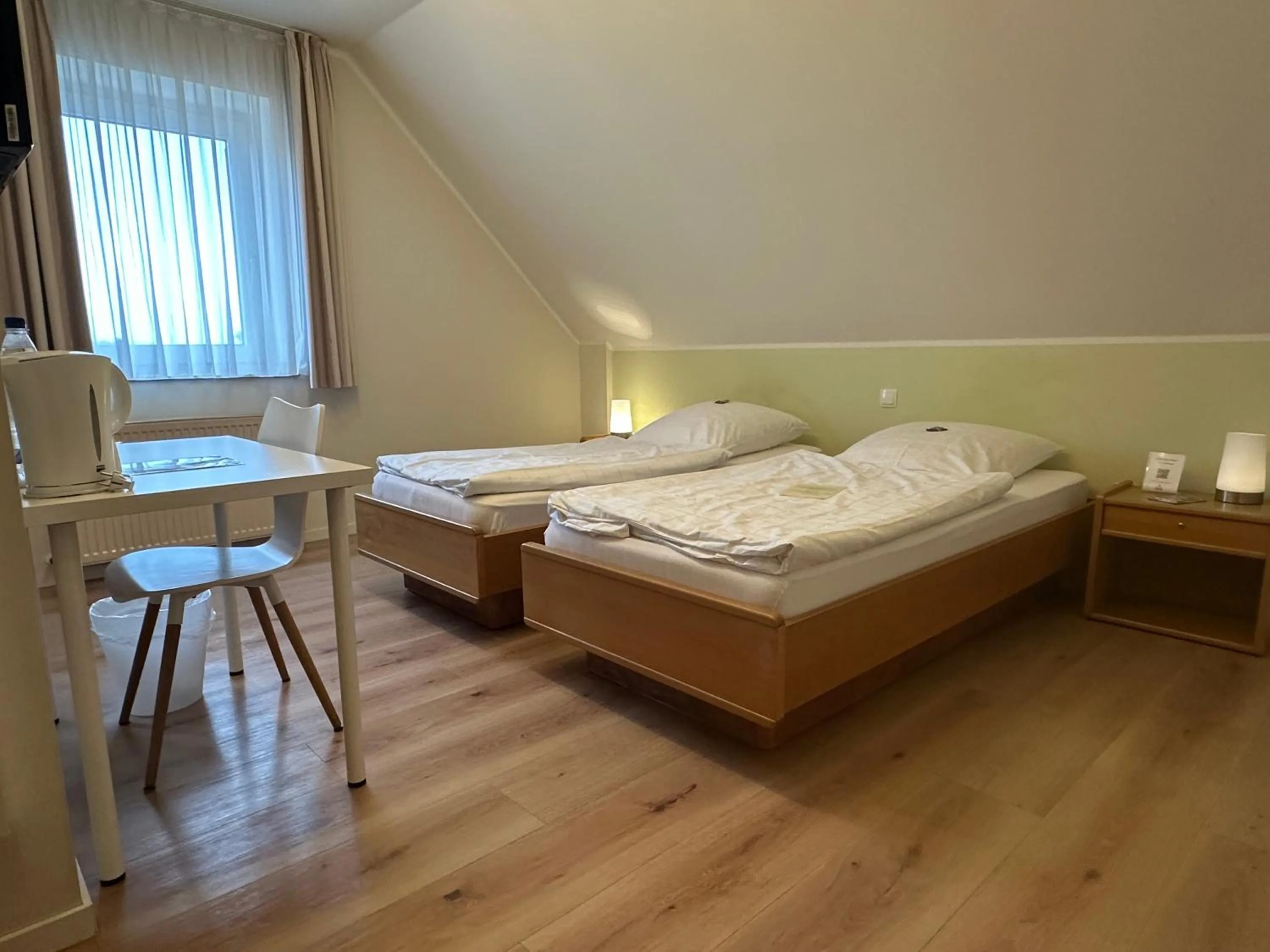 Photo of the whole room, Bed in Landgasthaus Hotel Wolters