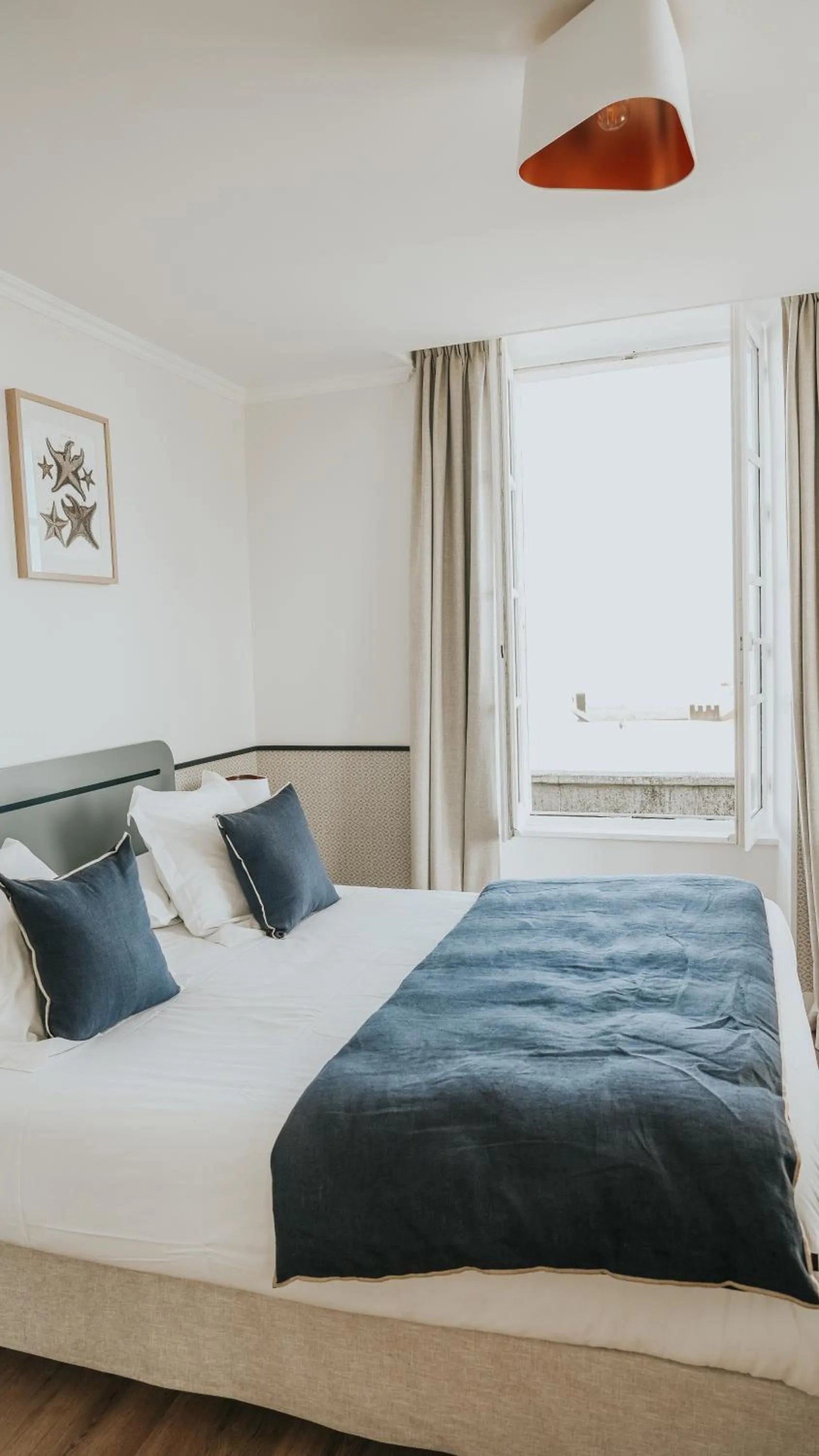 Bed in Hôtel De La Marine