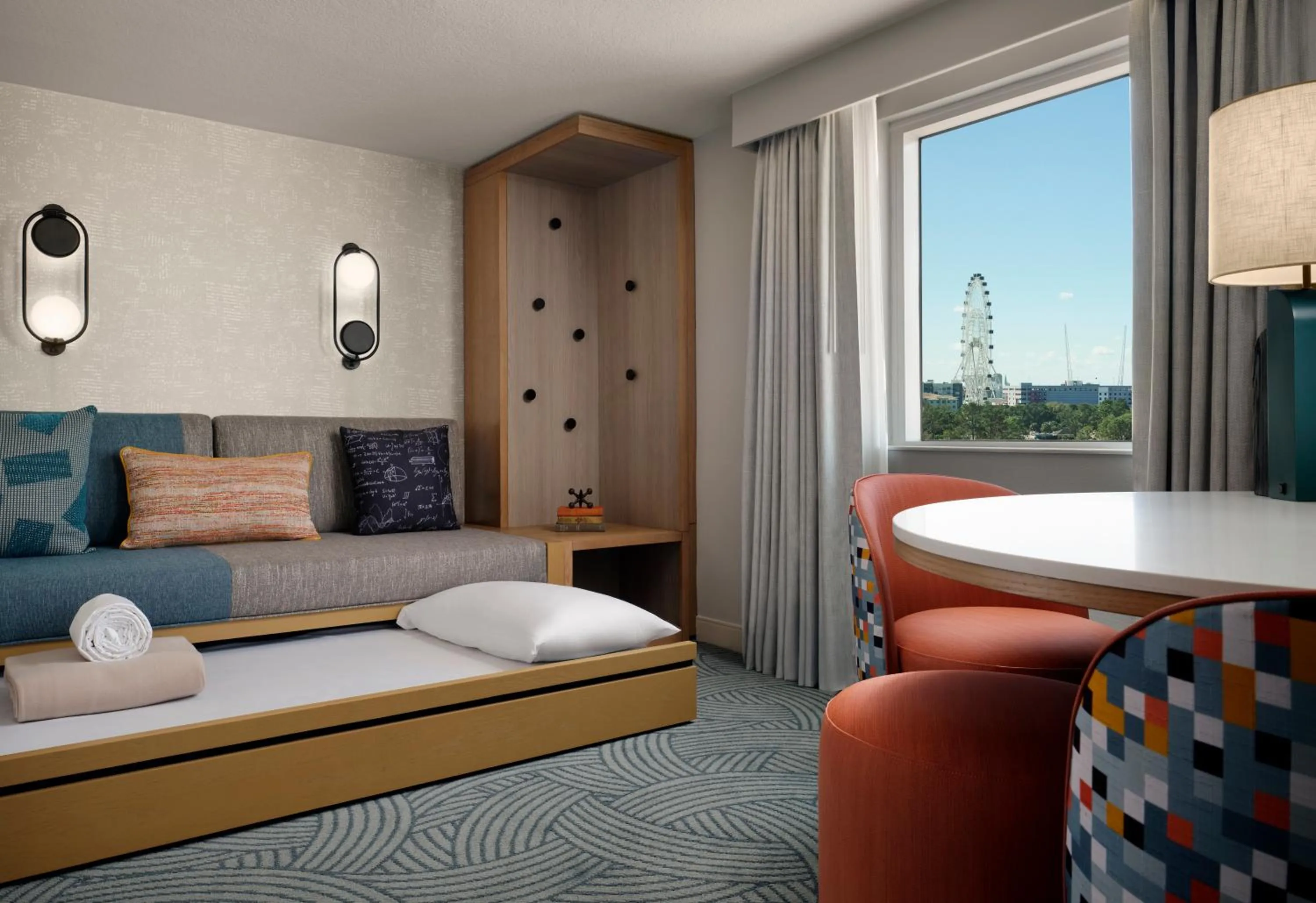 Living room, Bed in Hotel Landy Orlando Universal Blvd, a Tribute Portfolio Hotel