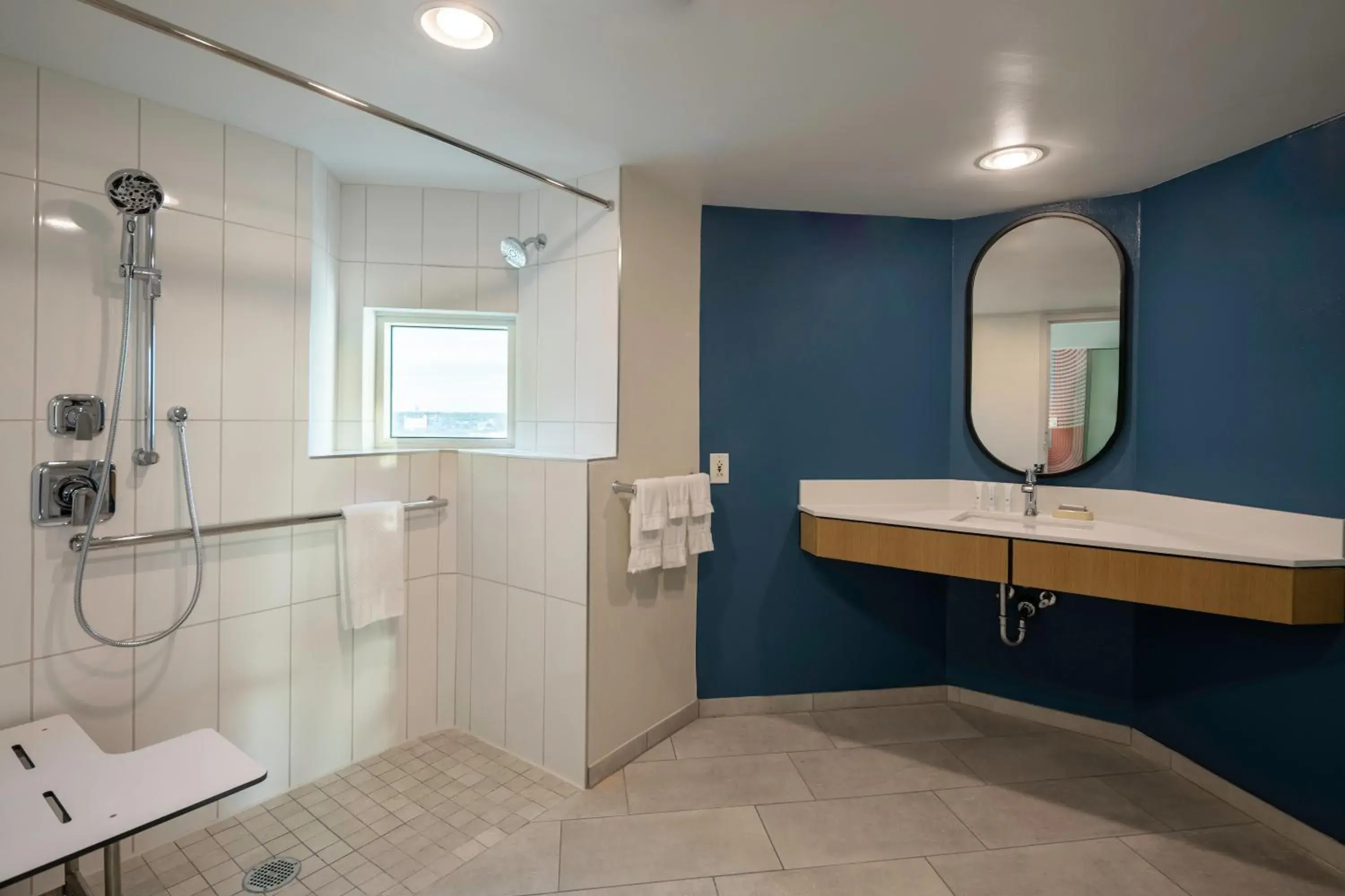 King Room with Roll-In Shower and Skyline View - Mobility Accessible in Hotel Kinetic Orlando Universal Blvd King Room with Roll-In Shower and Skyline View - Mobility Accessible in Hotel Kinetic Orlando Universal Blvd