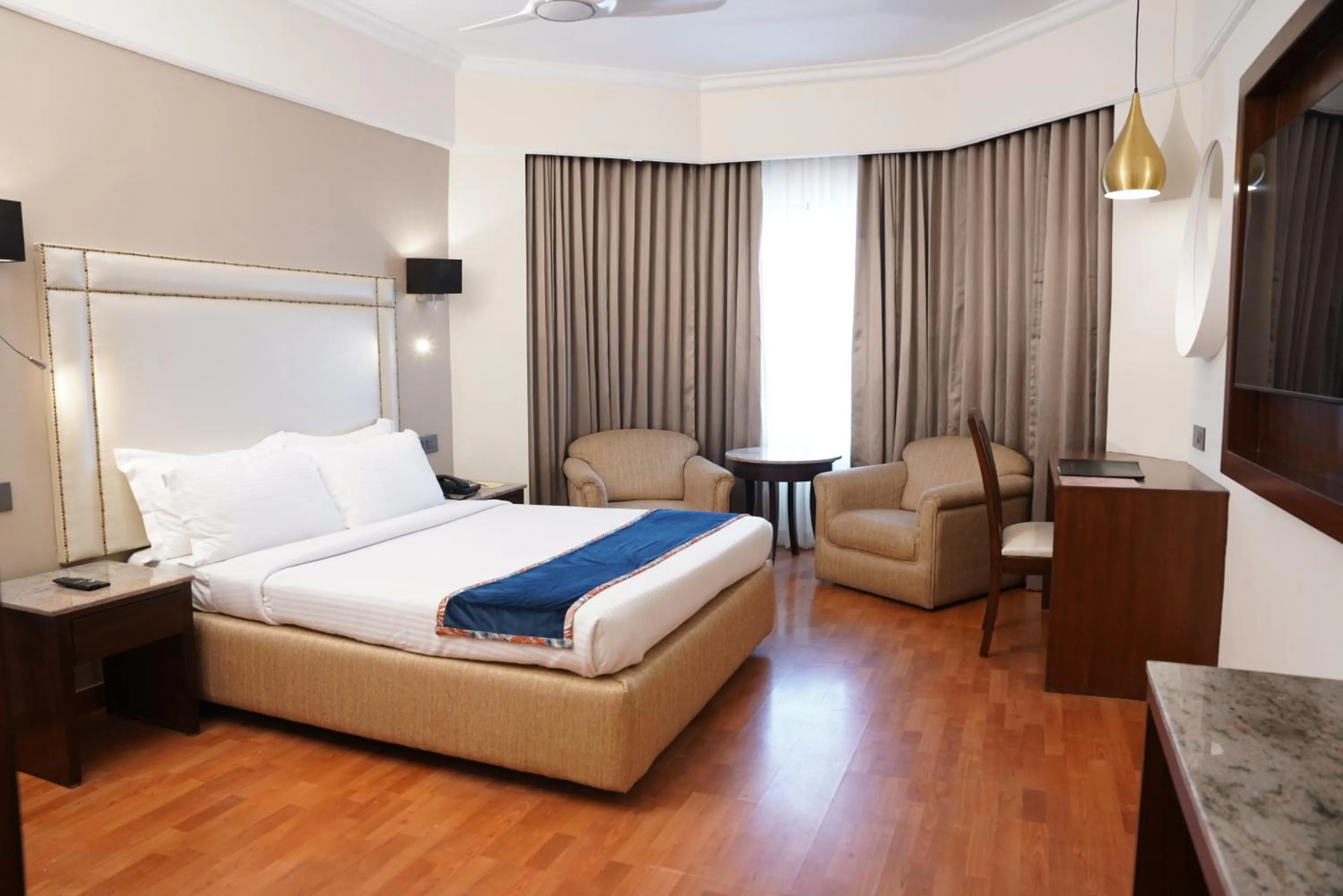 Bed in Katriya Hotel and Tower