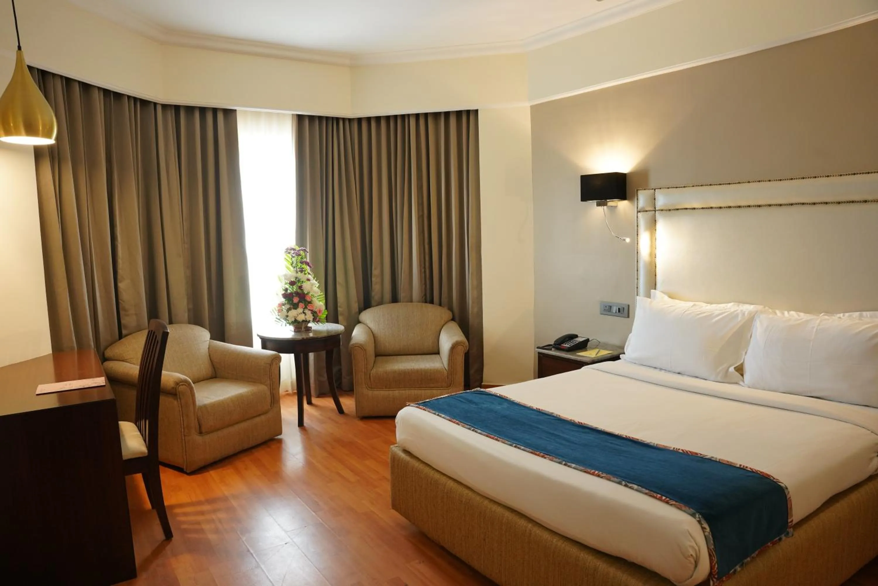 Bed in Katriya Hotel and Tower