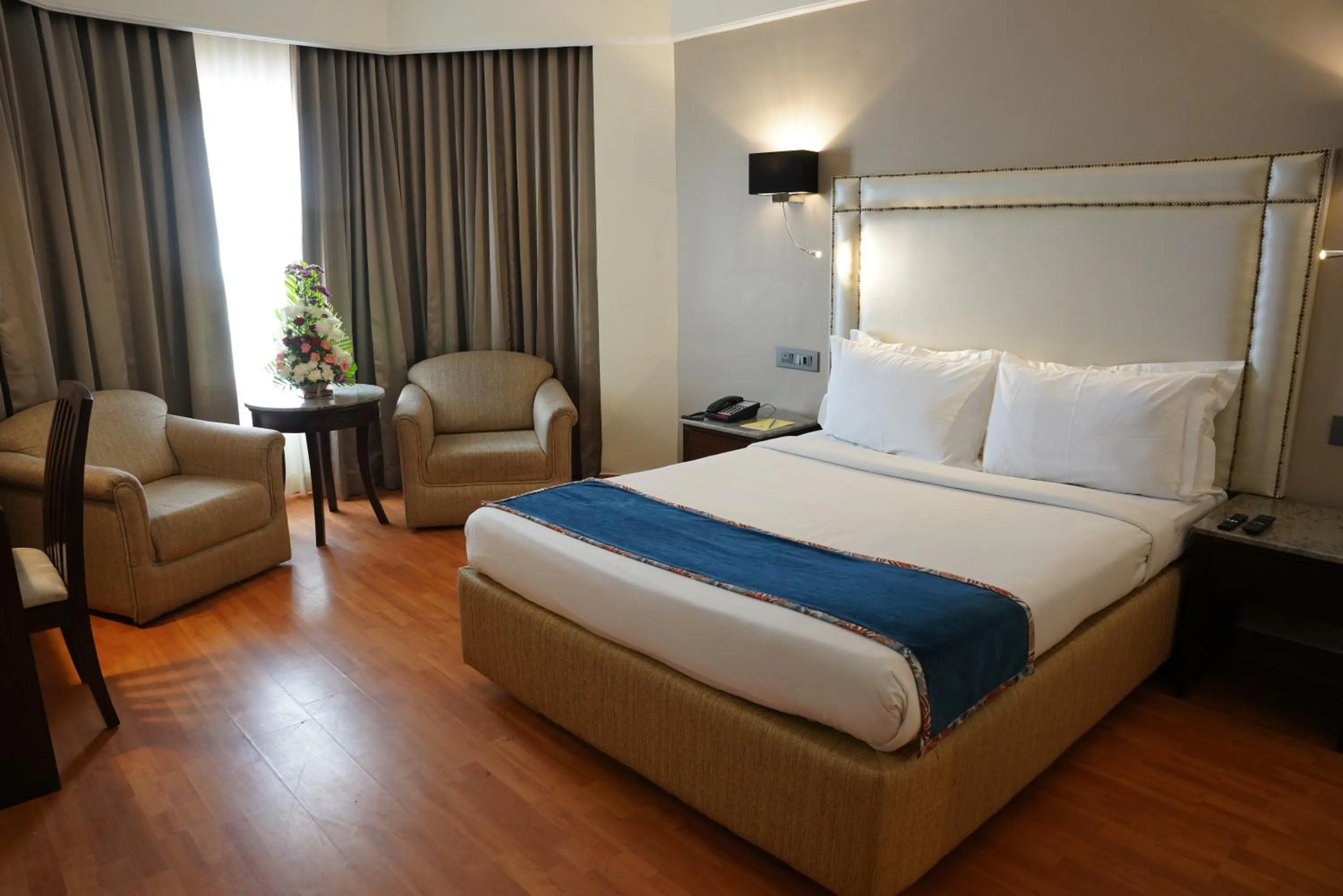 Bed in Katriya Hotel and Tower