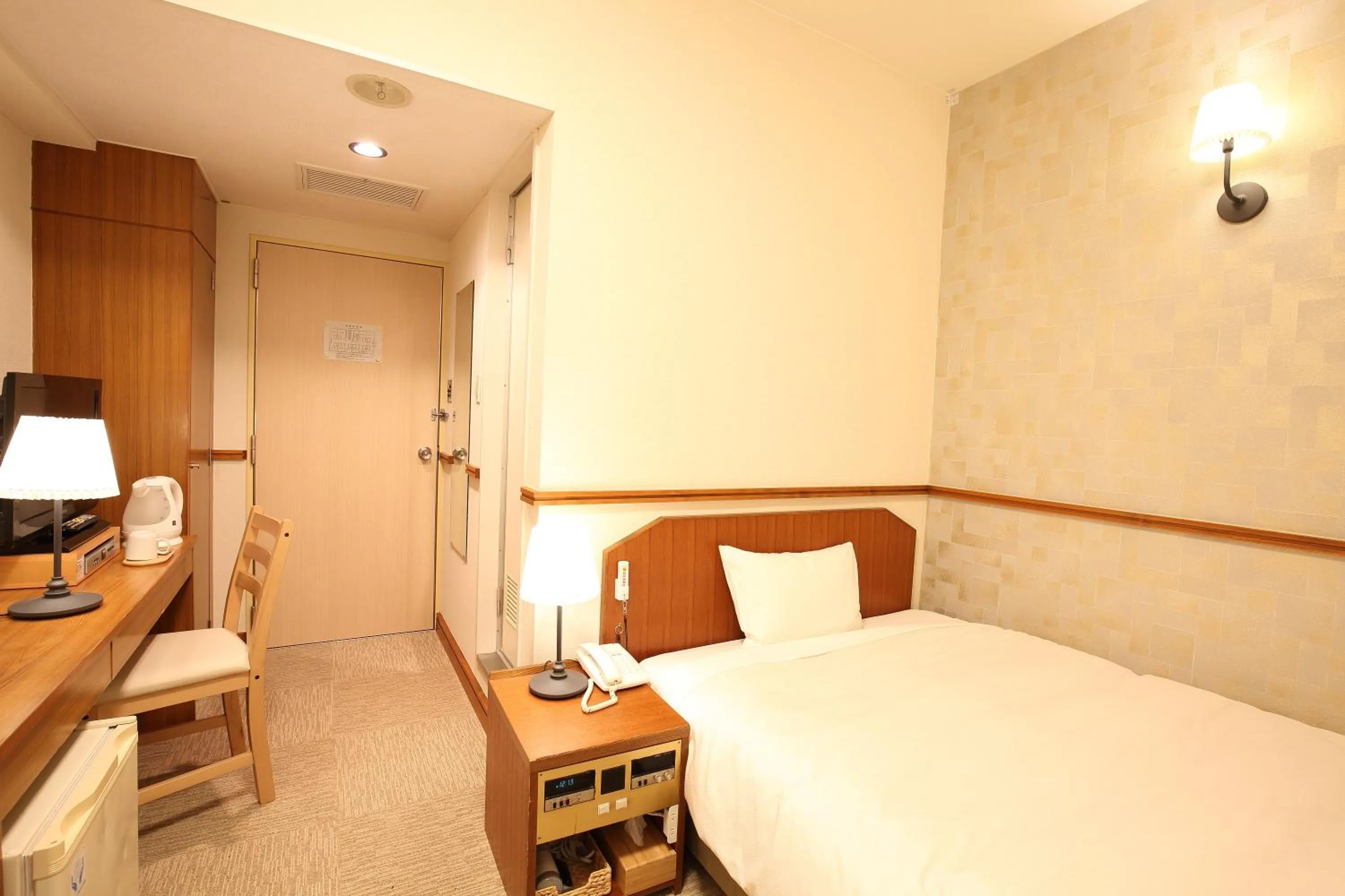 Bed in Hotel Nature Nagoya Sakae Kishu Railway Group