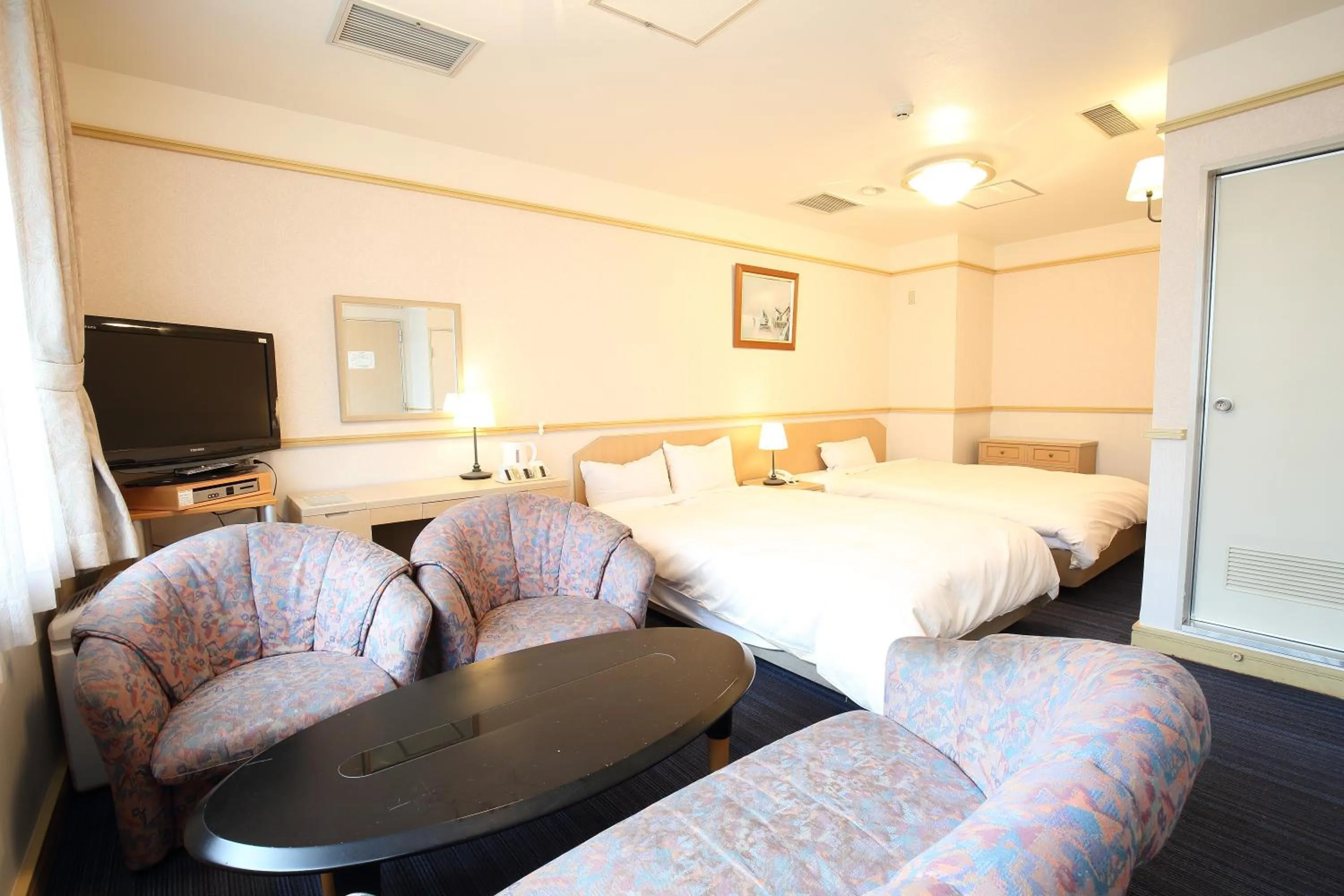 Bed in Hotel Nature Nagoya Sakae Kishu Railway Group