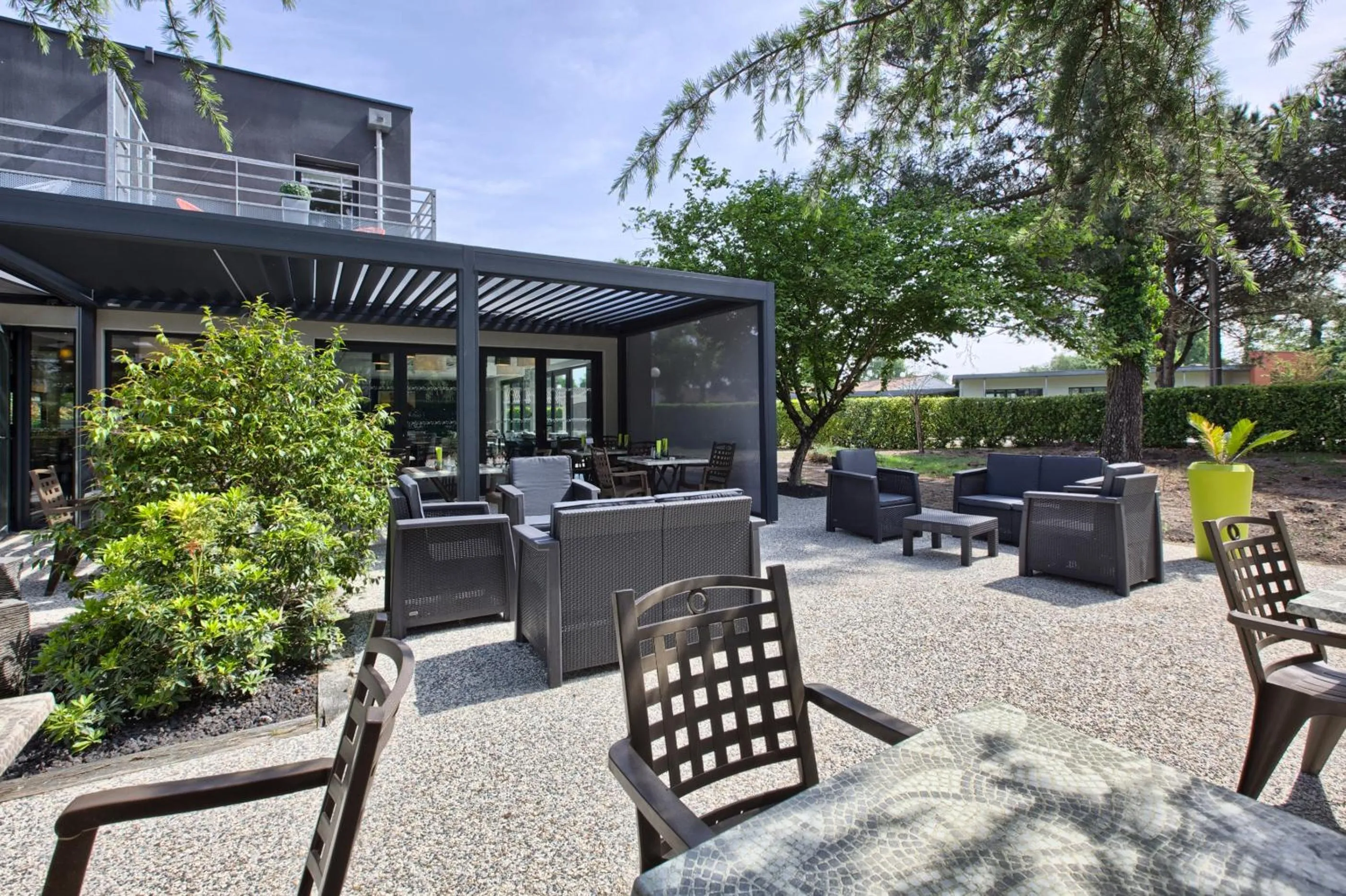 Patio in Logis Hotel Restaurant & SPA Au Comte d'Ornon