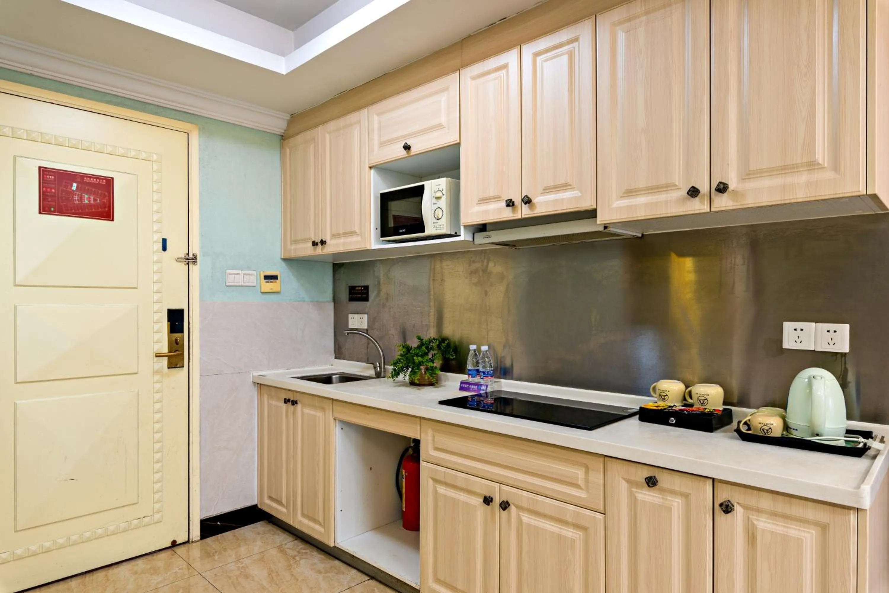 Kitchen or kitchenette in Guangzhou Manhattan International Apartment Zhengjia Free bus services are provided for the first and second phases