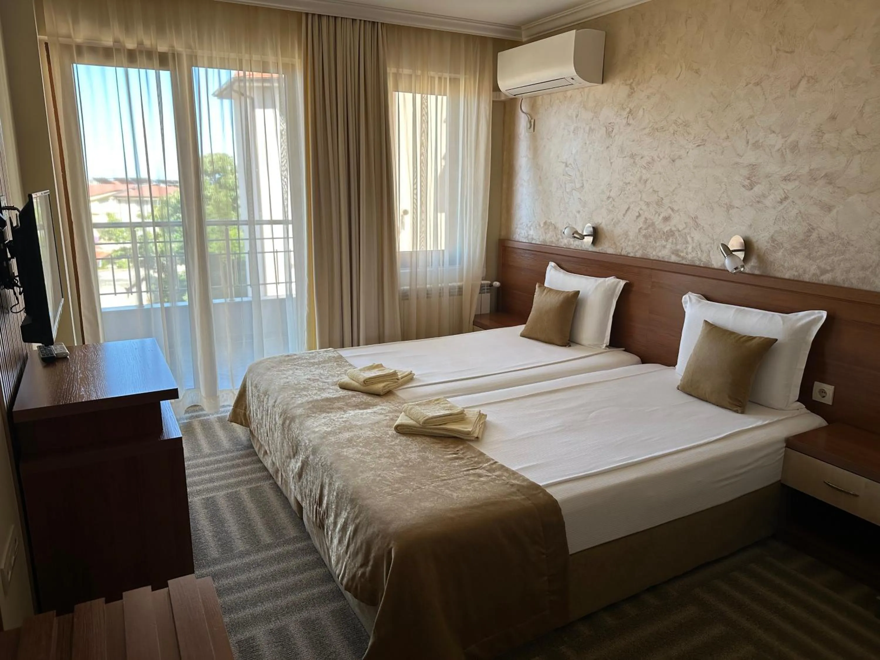 Bed in Family Hotel Radiana