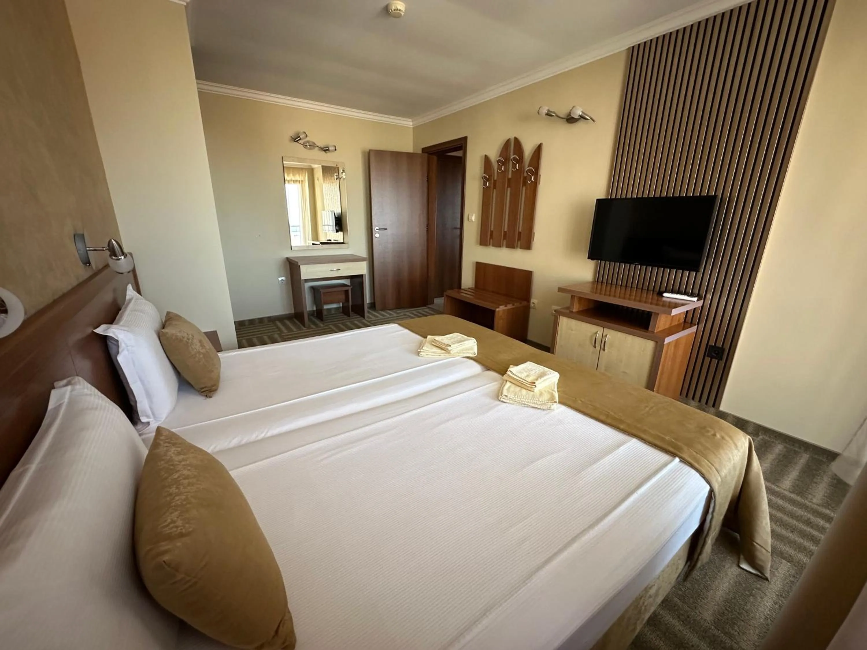 Bed in Family Hotel Radiana