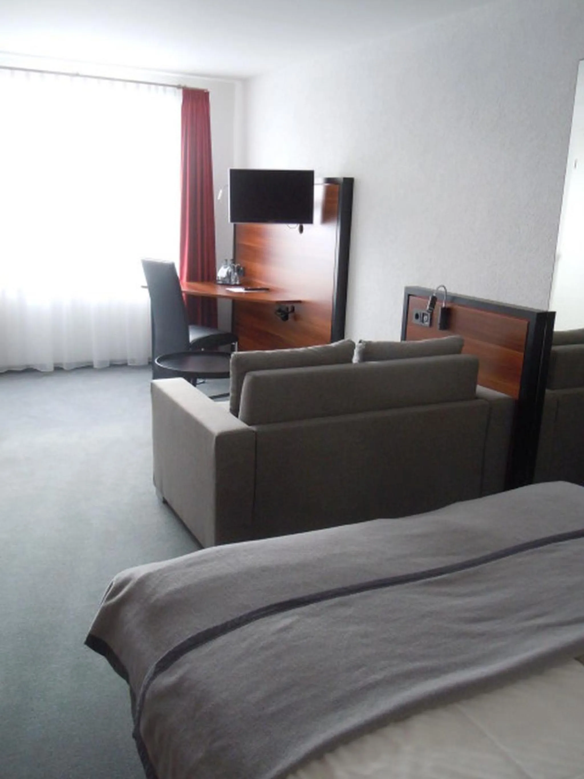 Photo of the whole room, Bed in Allgäuhotel Memmingen Nord