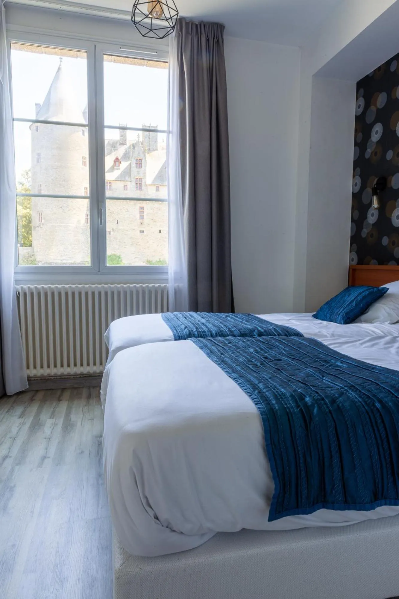 Bedroom in Hôtel Restaurant Du Château