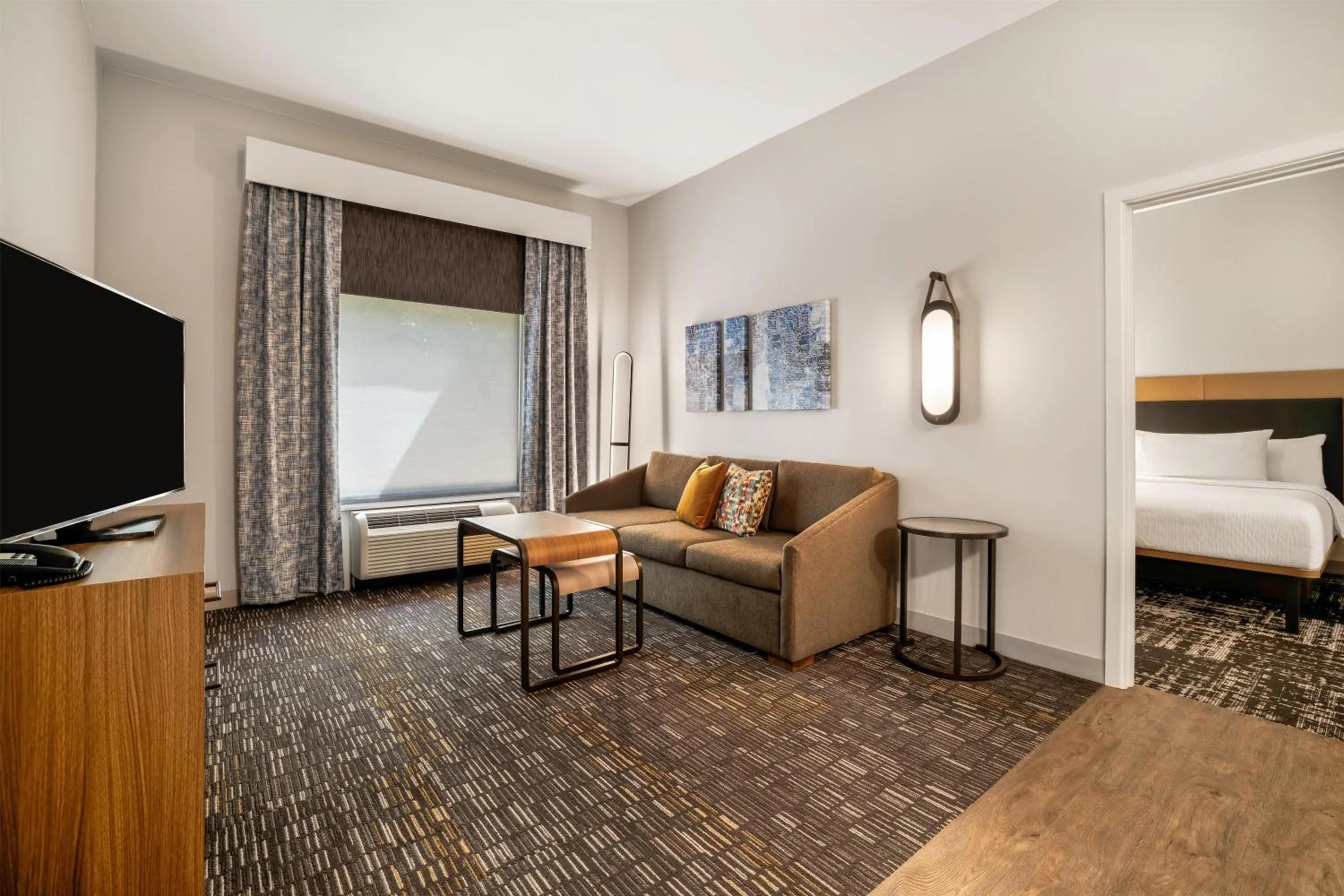Living room, Bed in Homewood Suites Dallas-Frisco