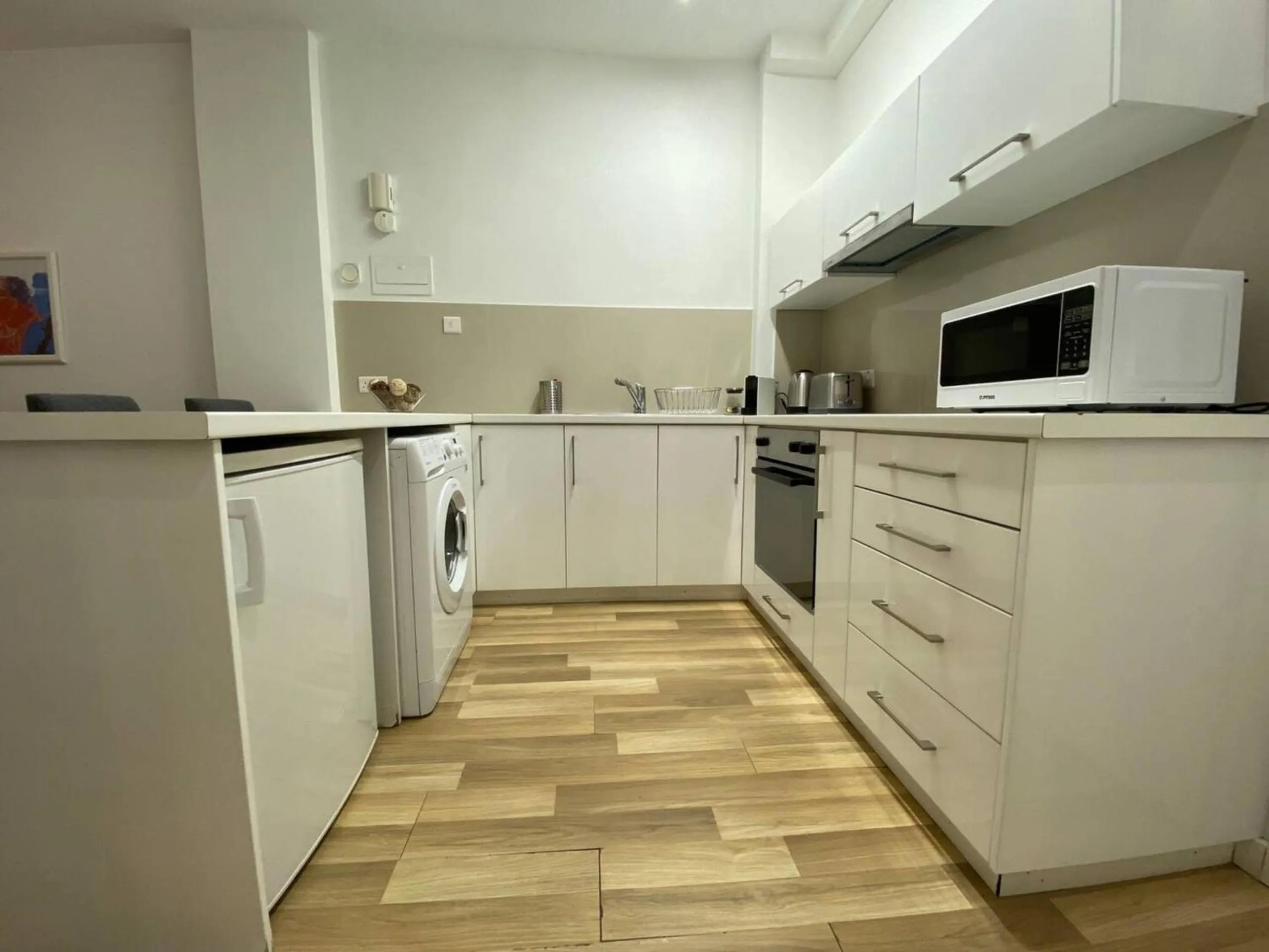 kitchen in SeaBreeze City Center Flats by TrulyCyprus