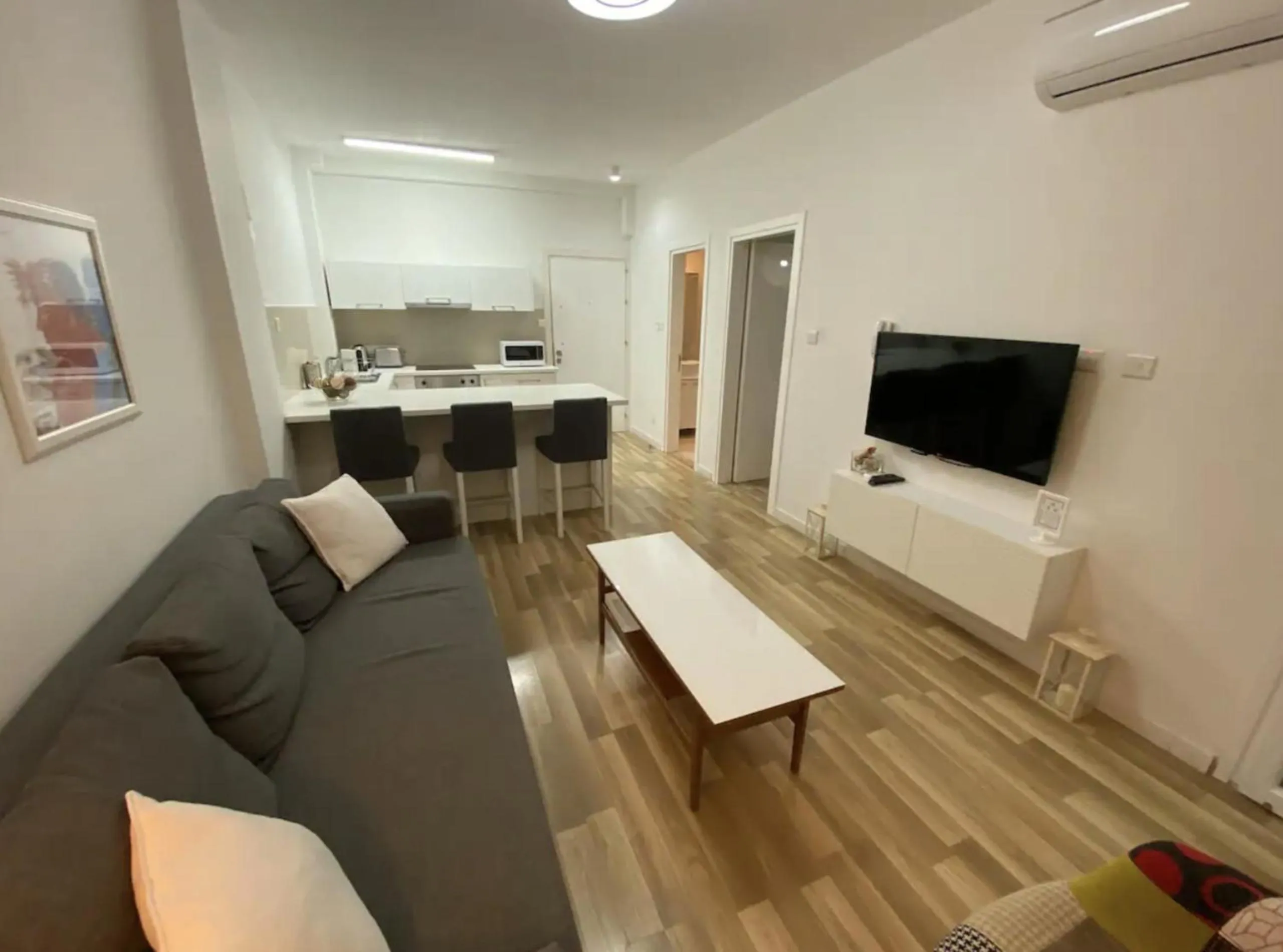 Living room in SeaBreeze City Center Flats by TrulyCyprus