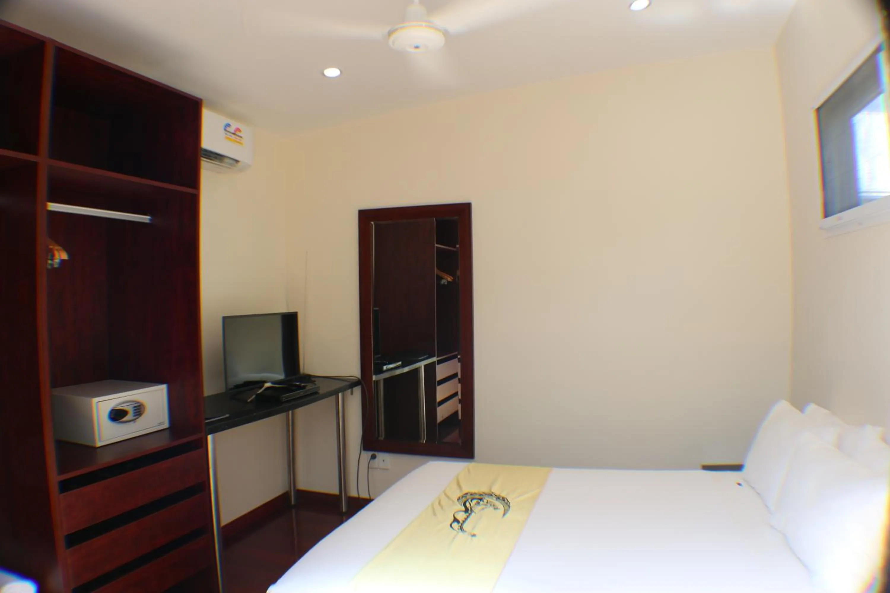 Bed in Kia Orana Villas and Spa