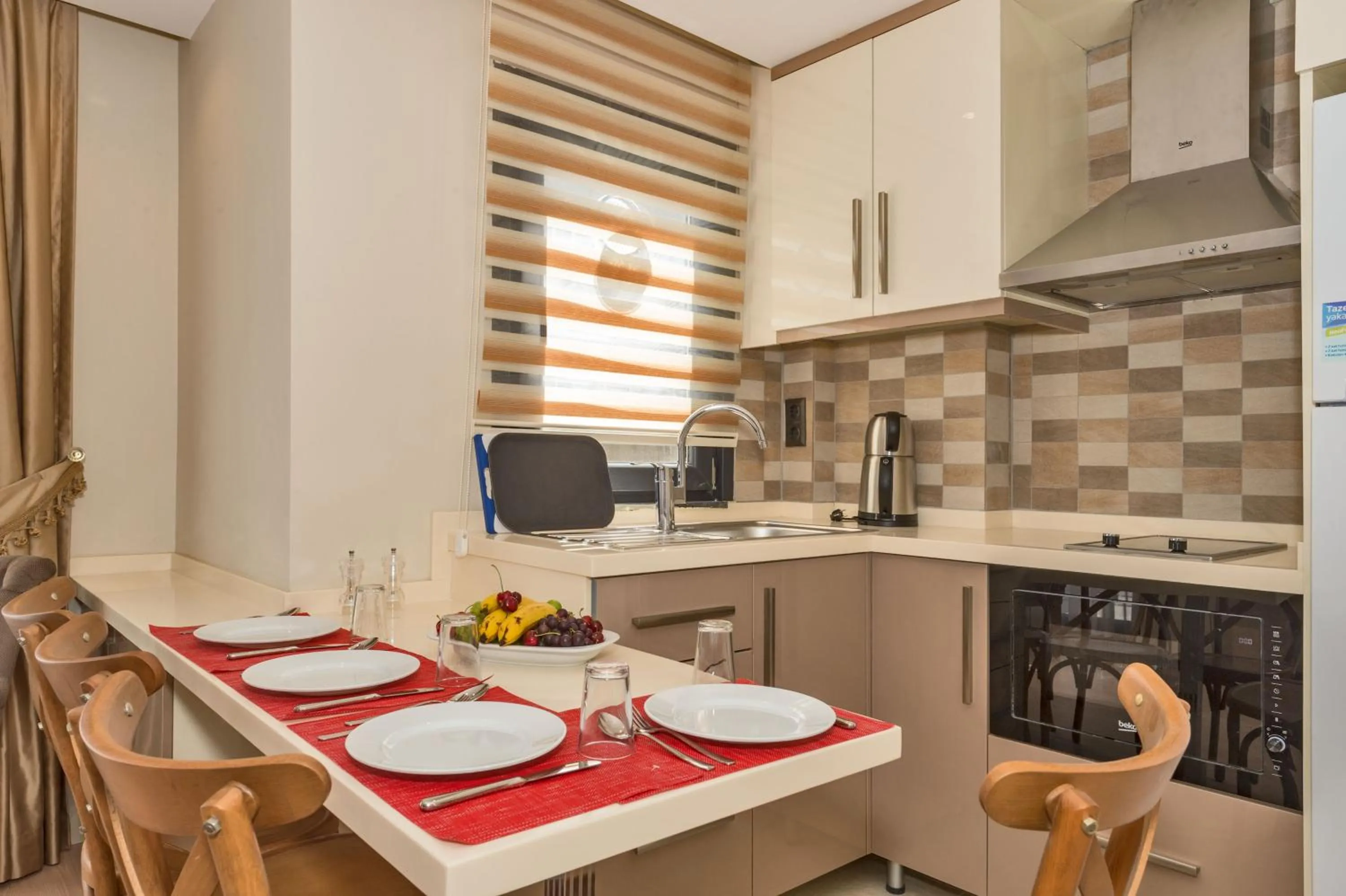 Kitchen or kitchenette in Gen Suites