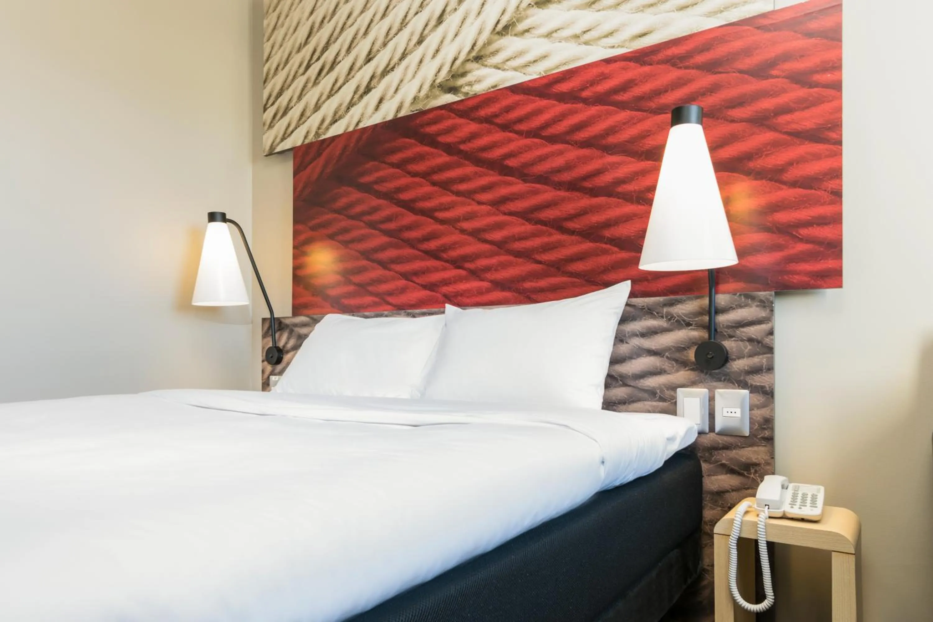 Decorative detail, Bed in ibis Zürich Messe Airport