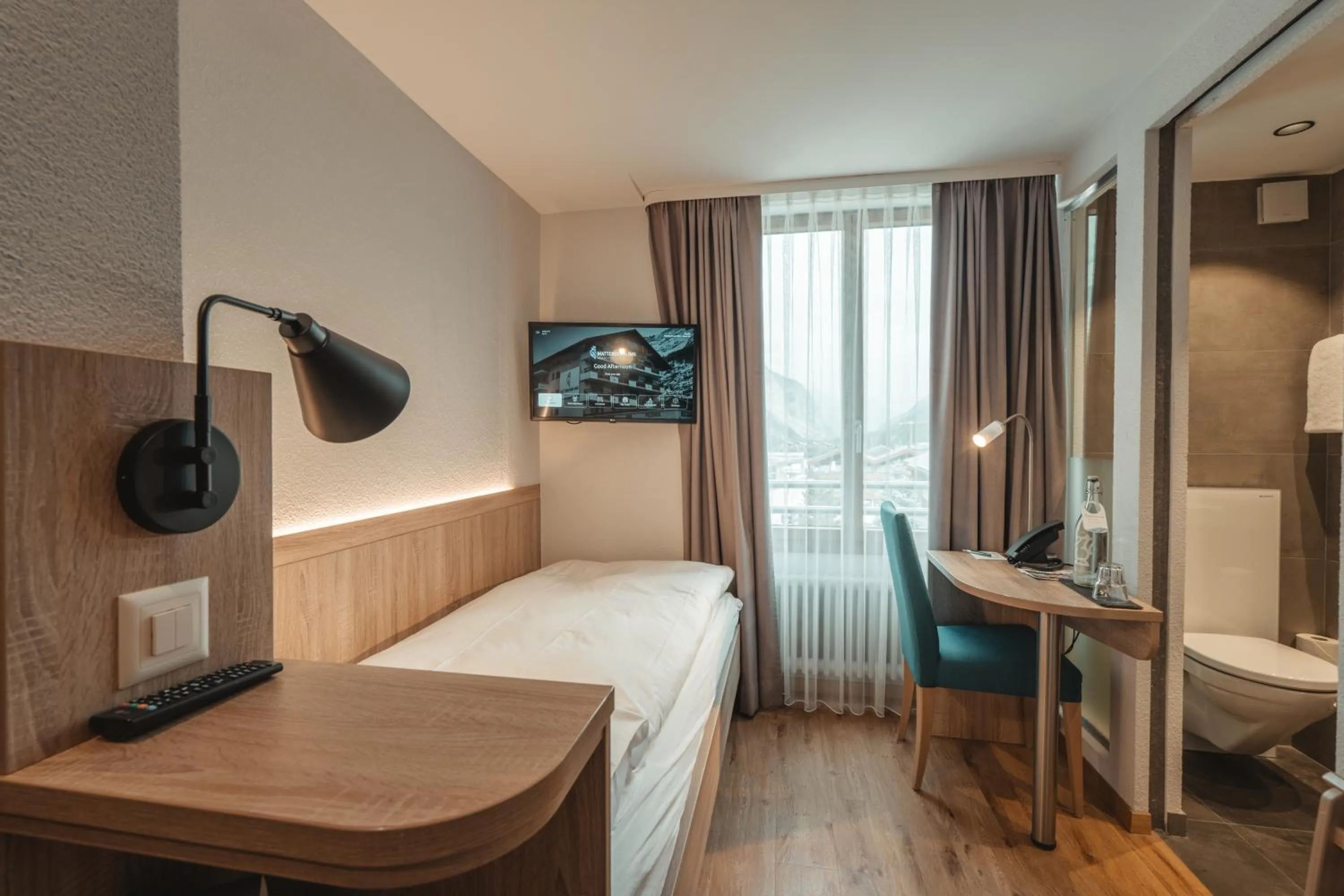 Bedroom, Bed in Hotel Matterhorn Inn