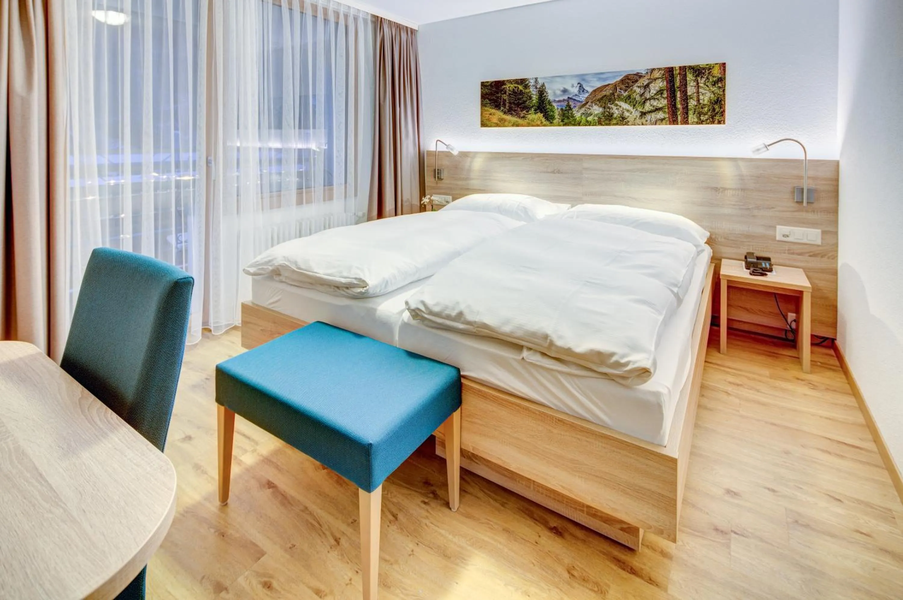 Bed in Hotel Matterhorn Inn