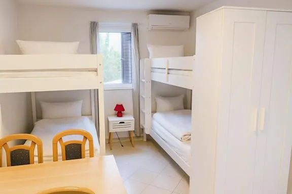 Bed in Lumbarda Resort Apartments