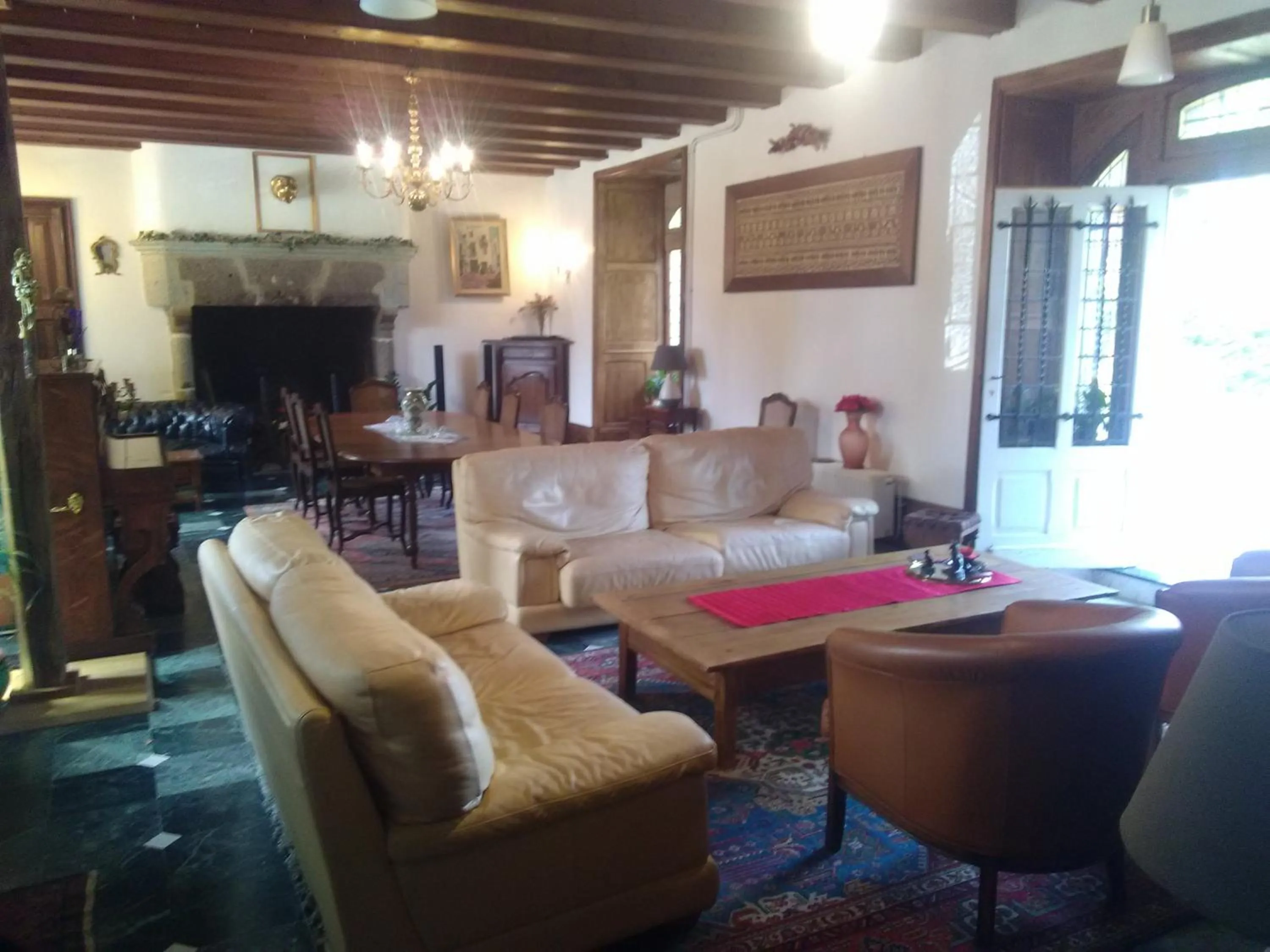 Communal lounge/ TV room in Pierre Deluen Domaine de la Grange de Quaire