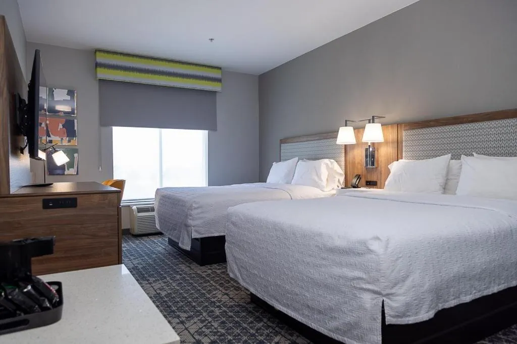 Bed in Hampton Inn & Suites Houston Rosenberg