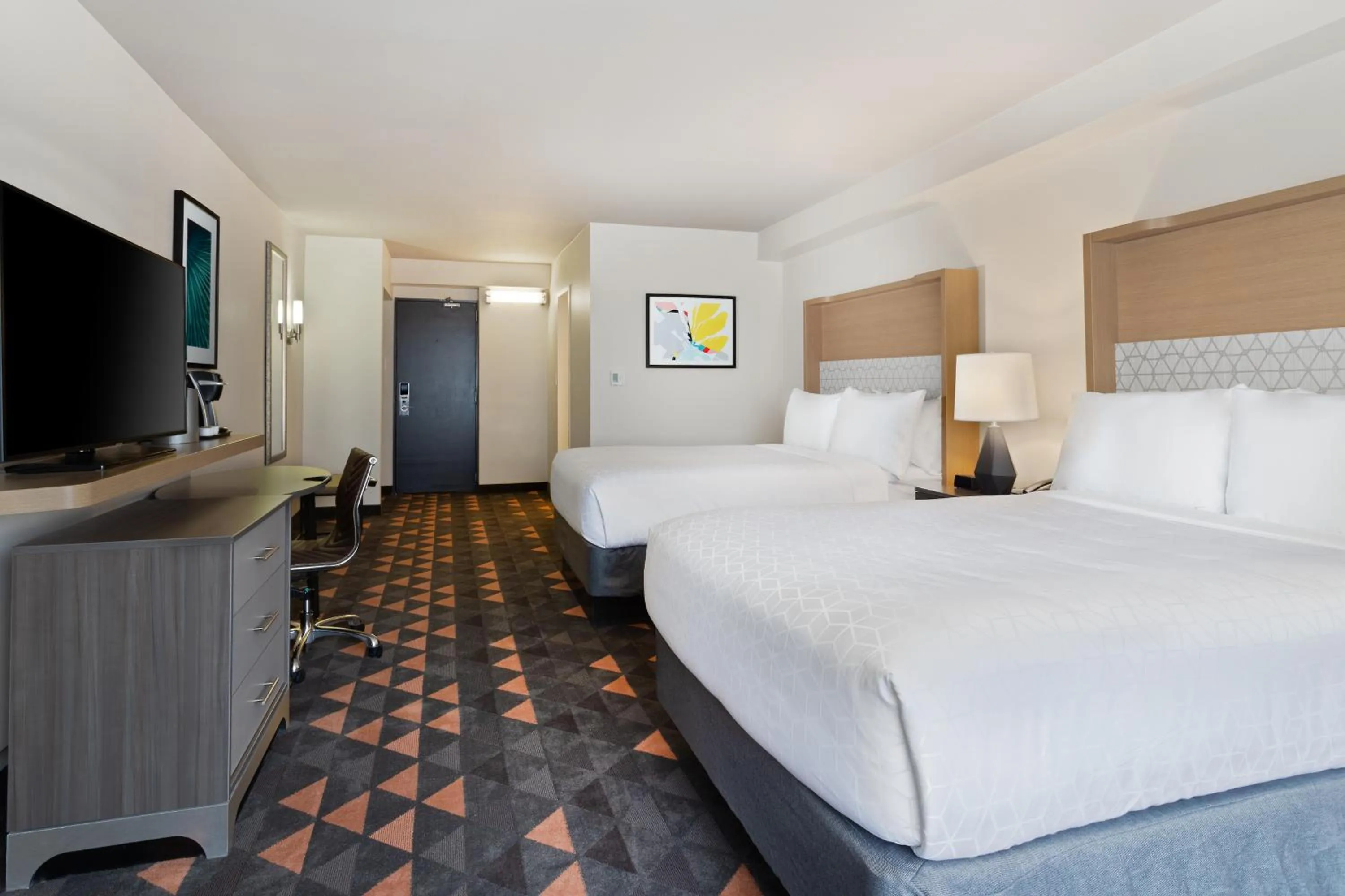 Bedroom, Bed in Holiday Inn & Suites Across from Universal Orlando by IHG