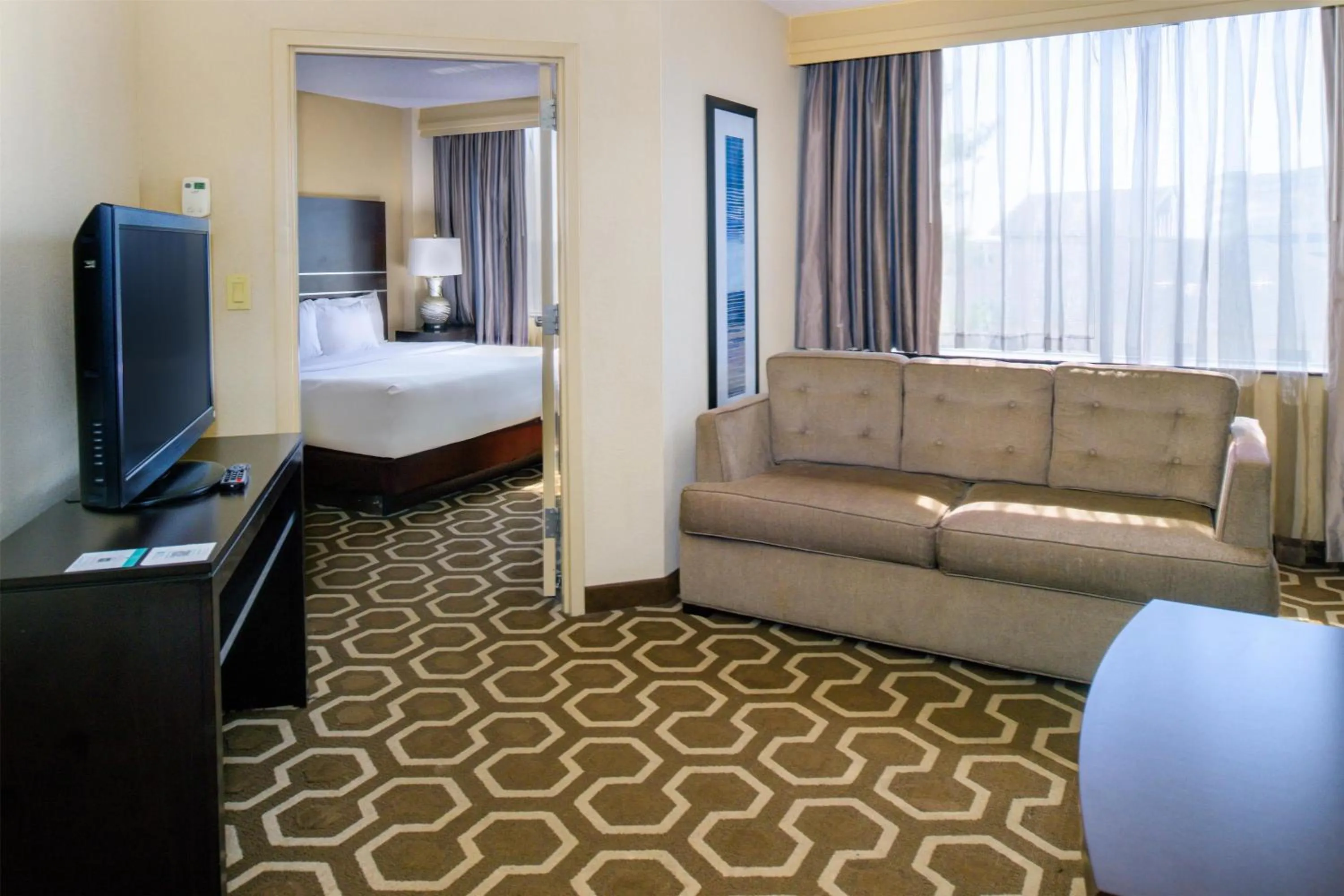 Living room, Bed in Embassy Suites by Hilton St Louis Airport