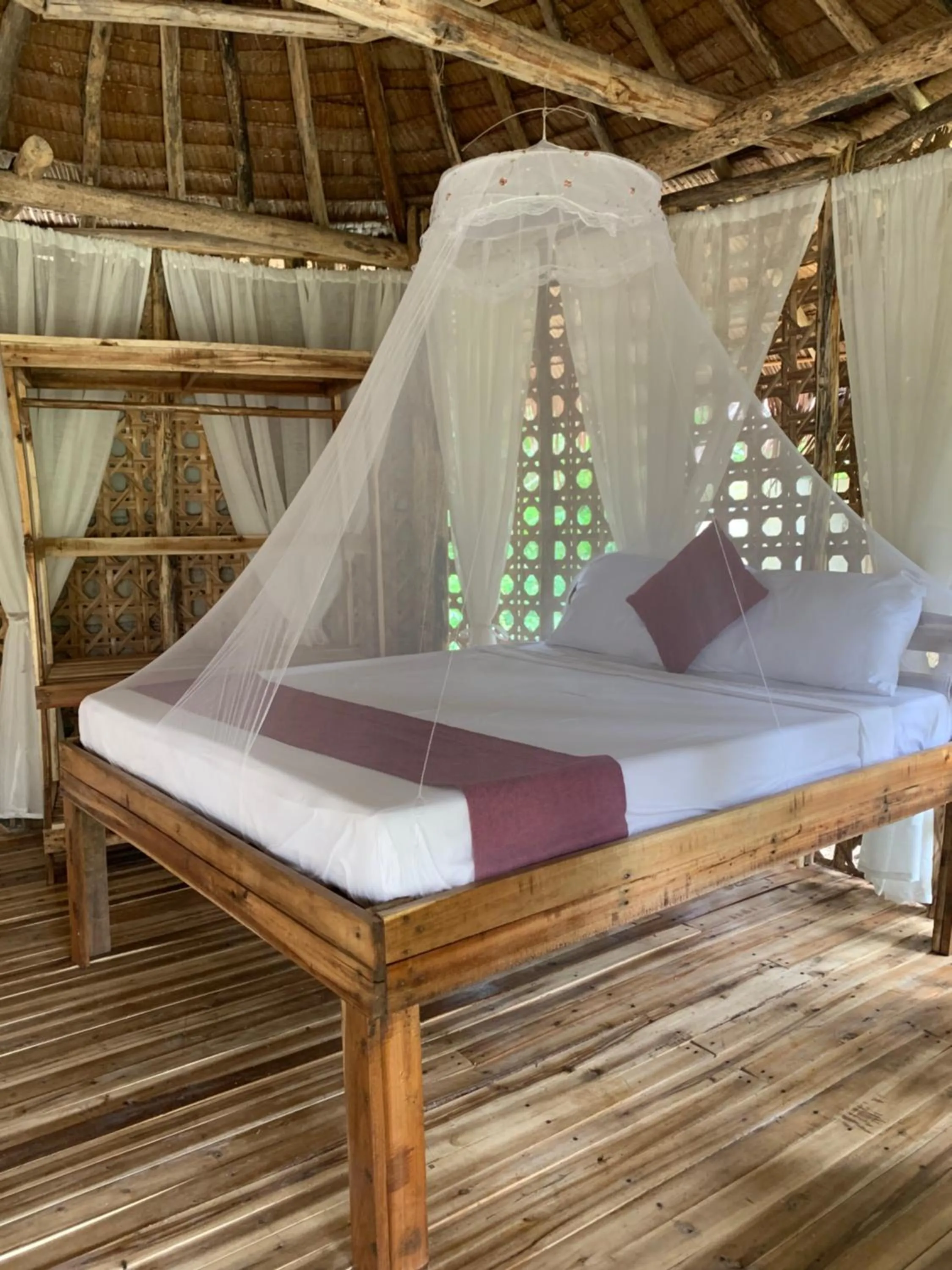 Bed in Prince John Beachfront Eco Bungalows and Restaurant