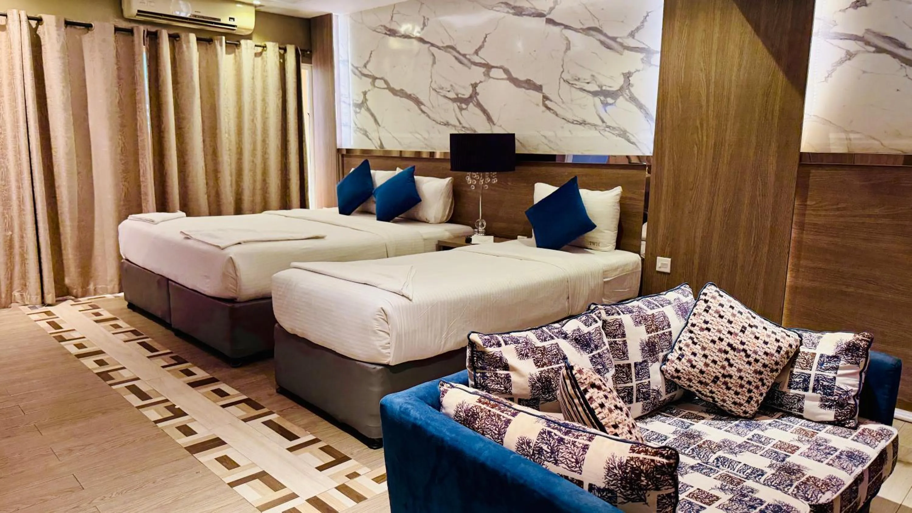 Bed in Trans World Hotel