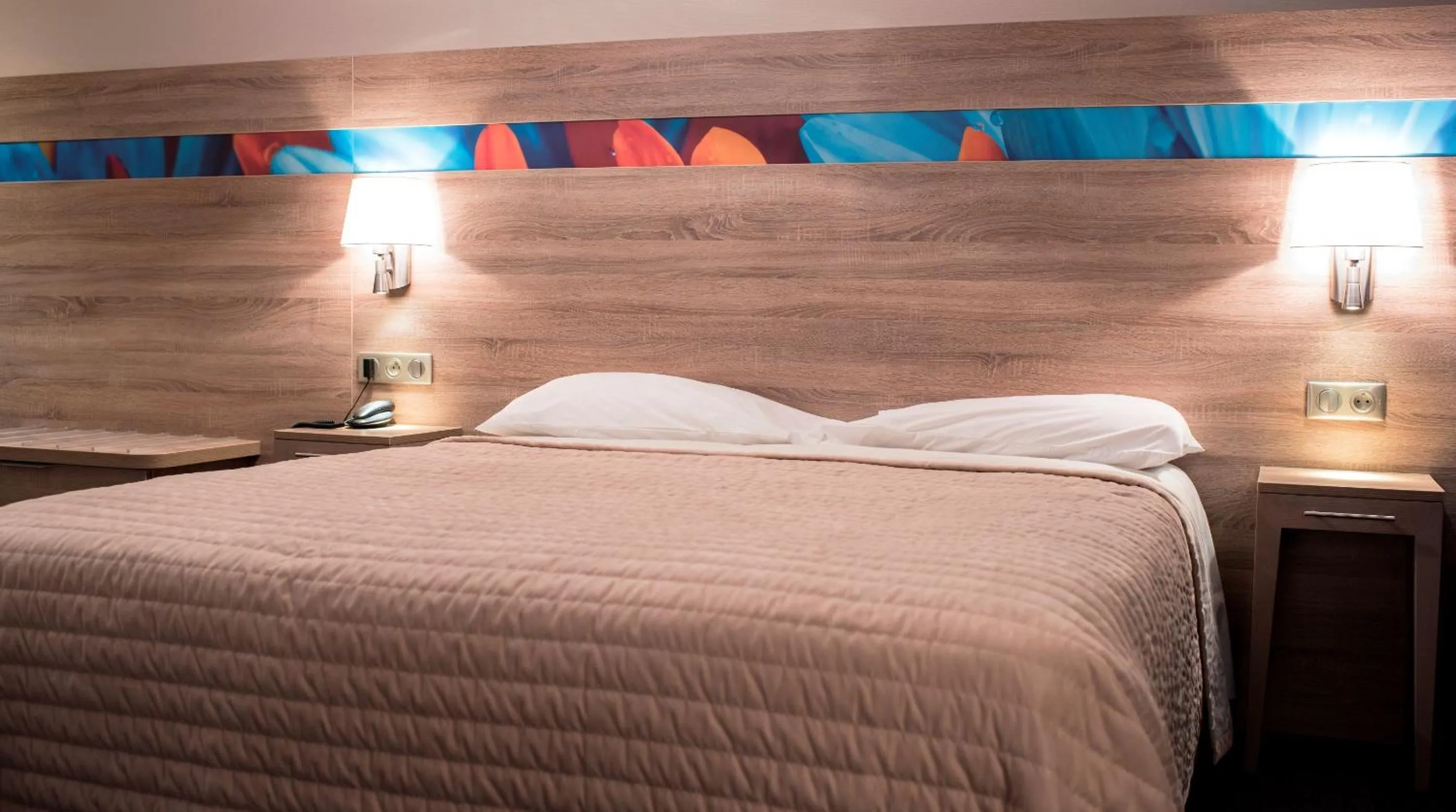 Bedroom in Hotel Restaurant Le Coquelicot