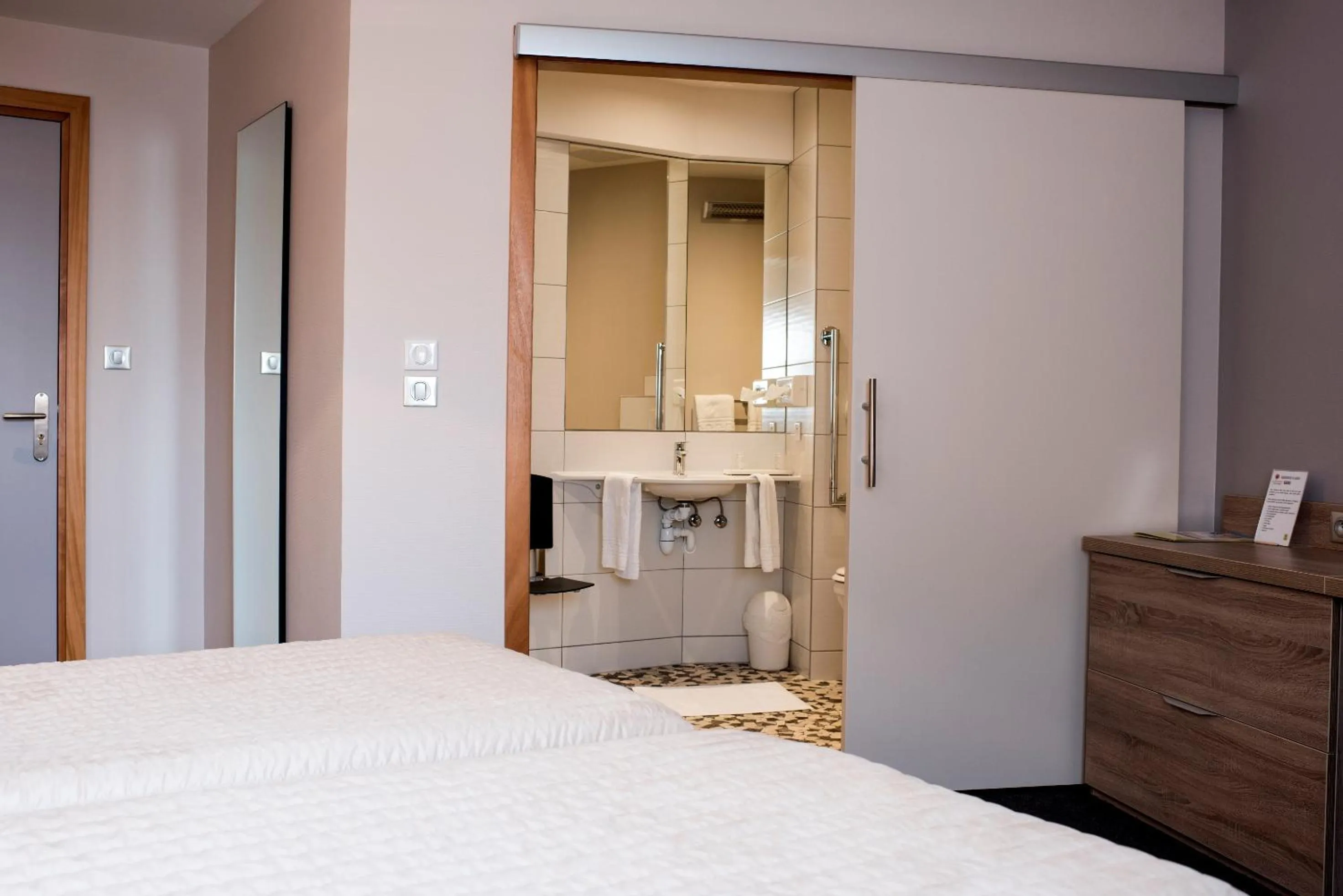 Bedroom in Hotel Restaurant Le Coquelicot