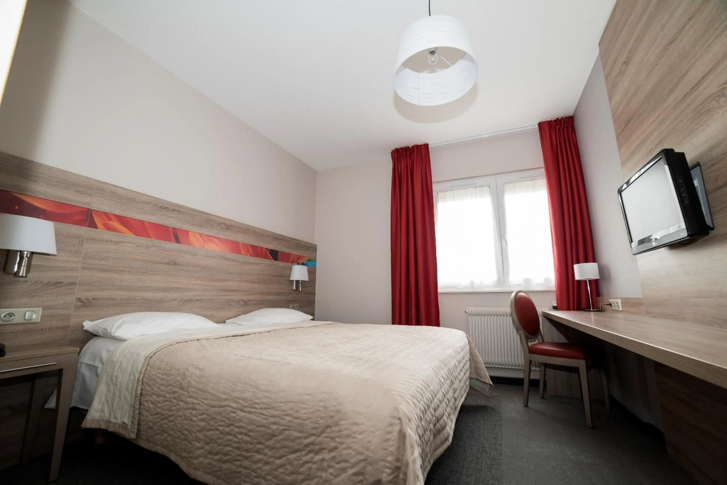 Bedroom in Hotel Restaurant Le Coquelicot