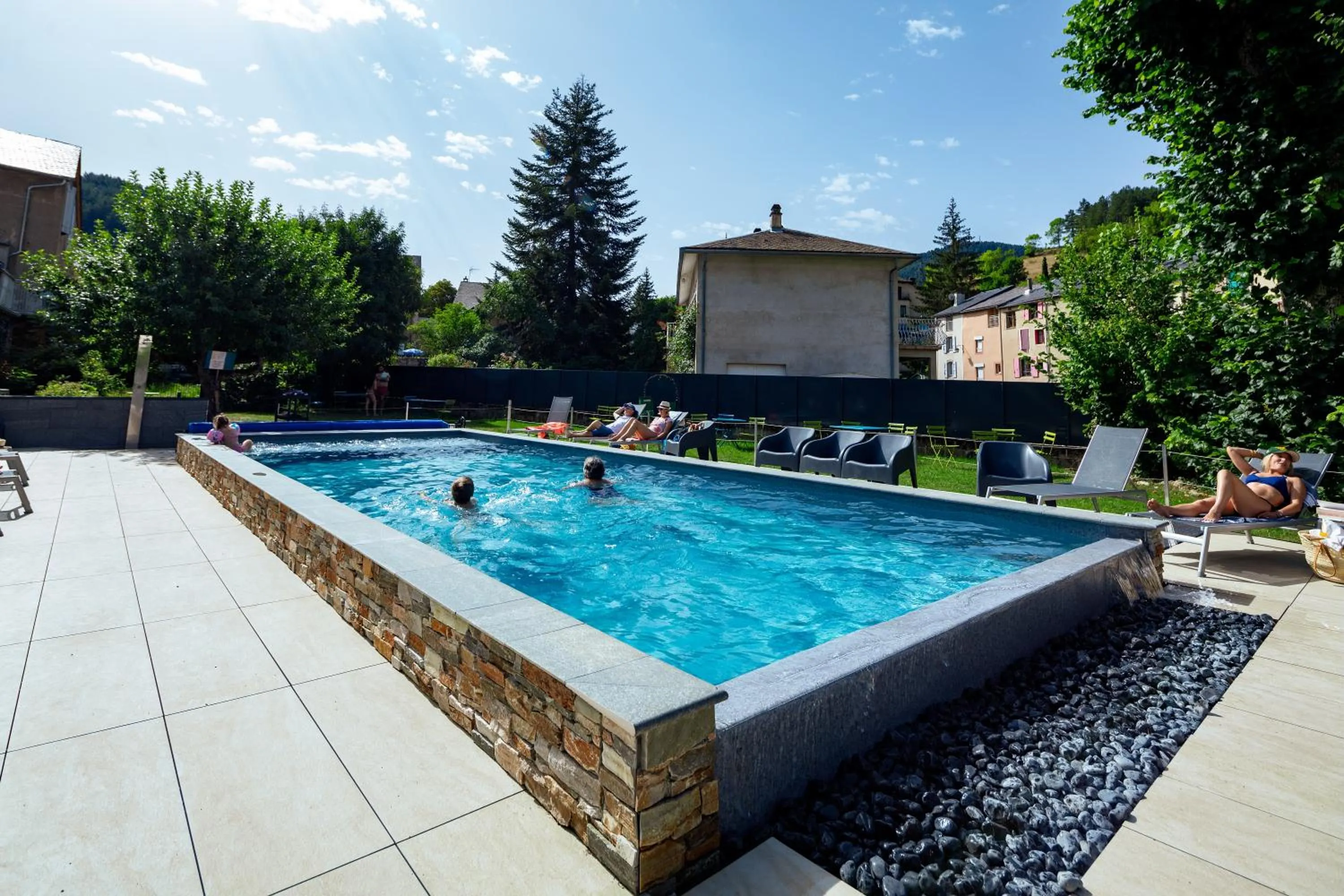 Swimming pool in Logis Hotel Restaurant Family & Spa