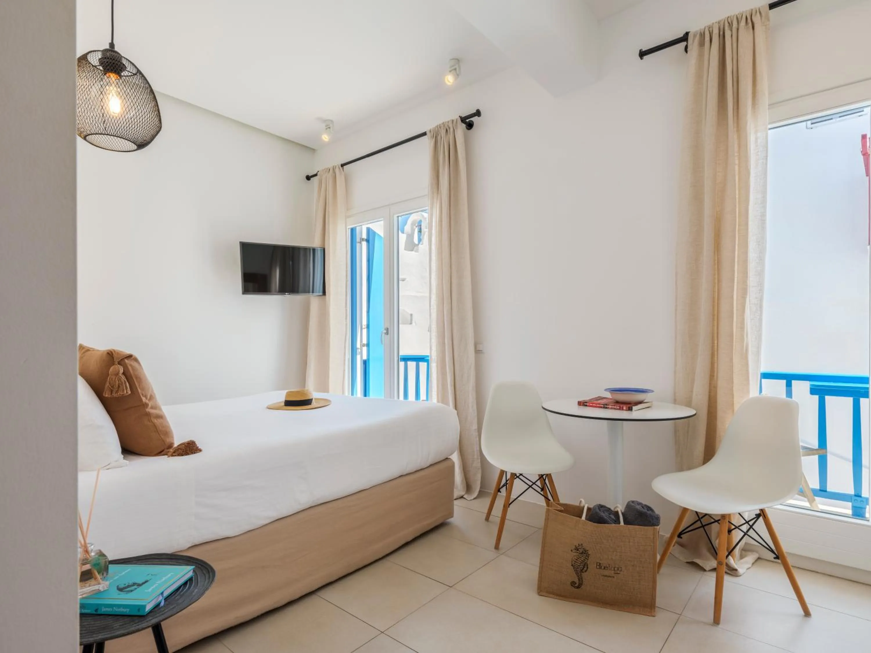 Photo of the whole room, Bed in Bluetopia Suites