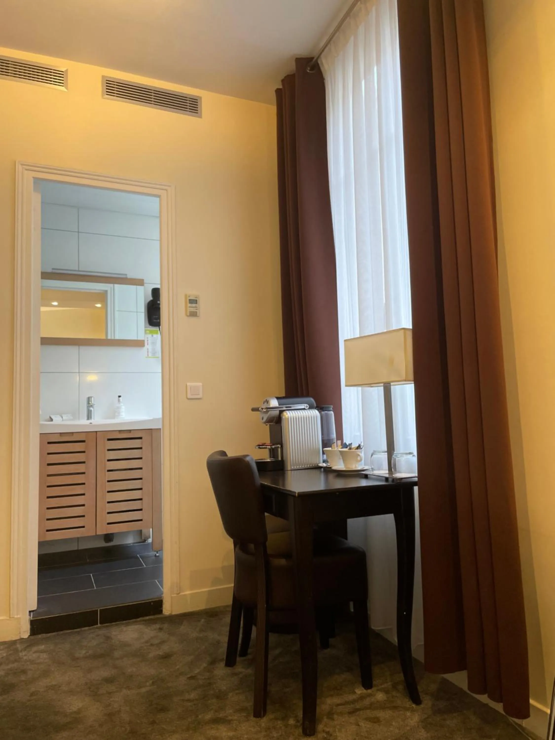 Bedroom in Lion d'Or Paris Hotel