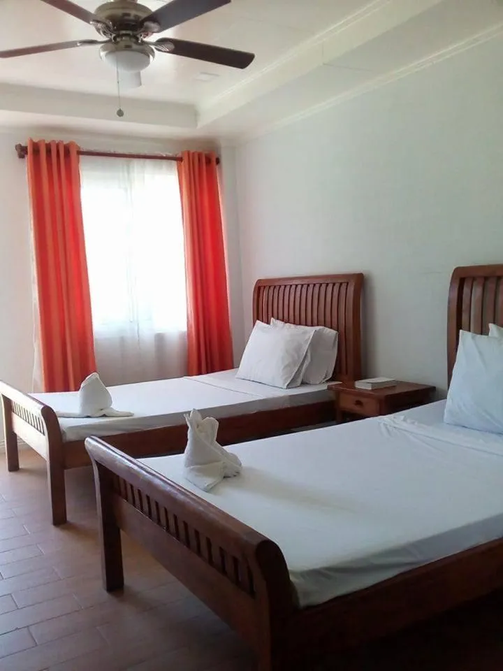 Bed in Happy Ripples Beach Resort