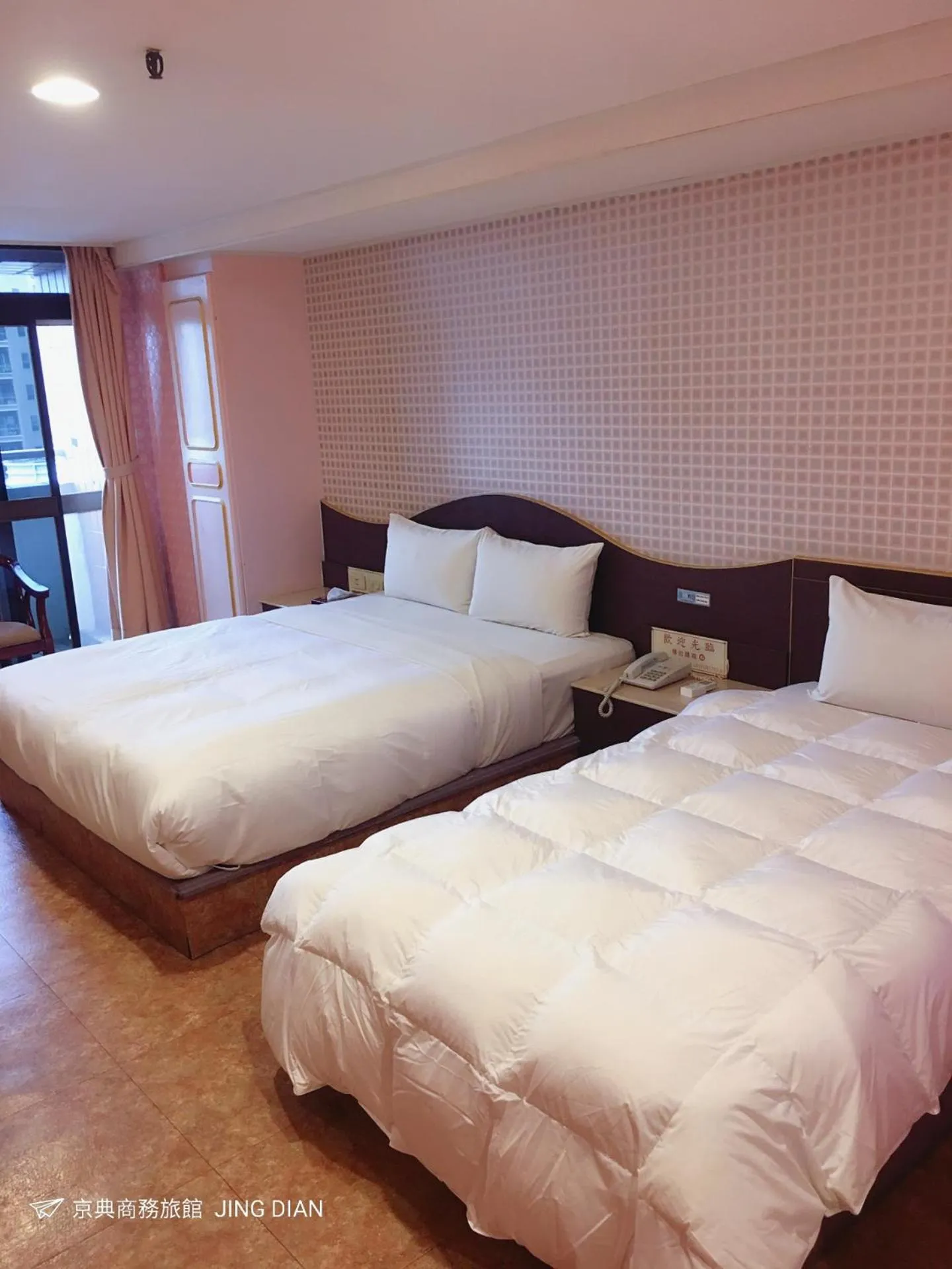 Bed in Jing Dian Business Hotel