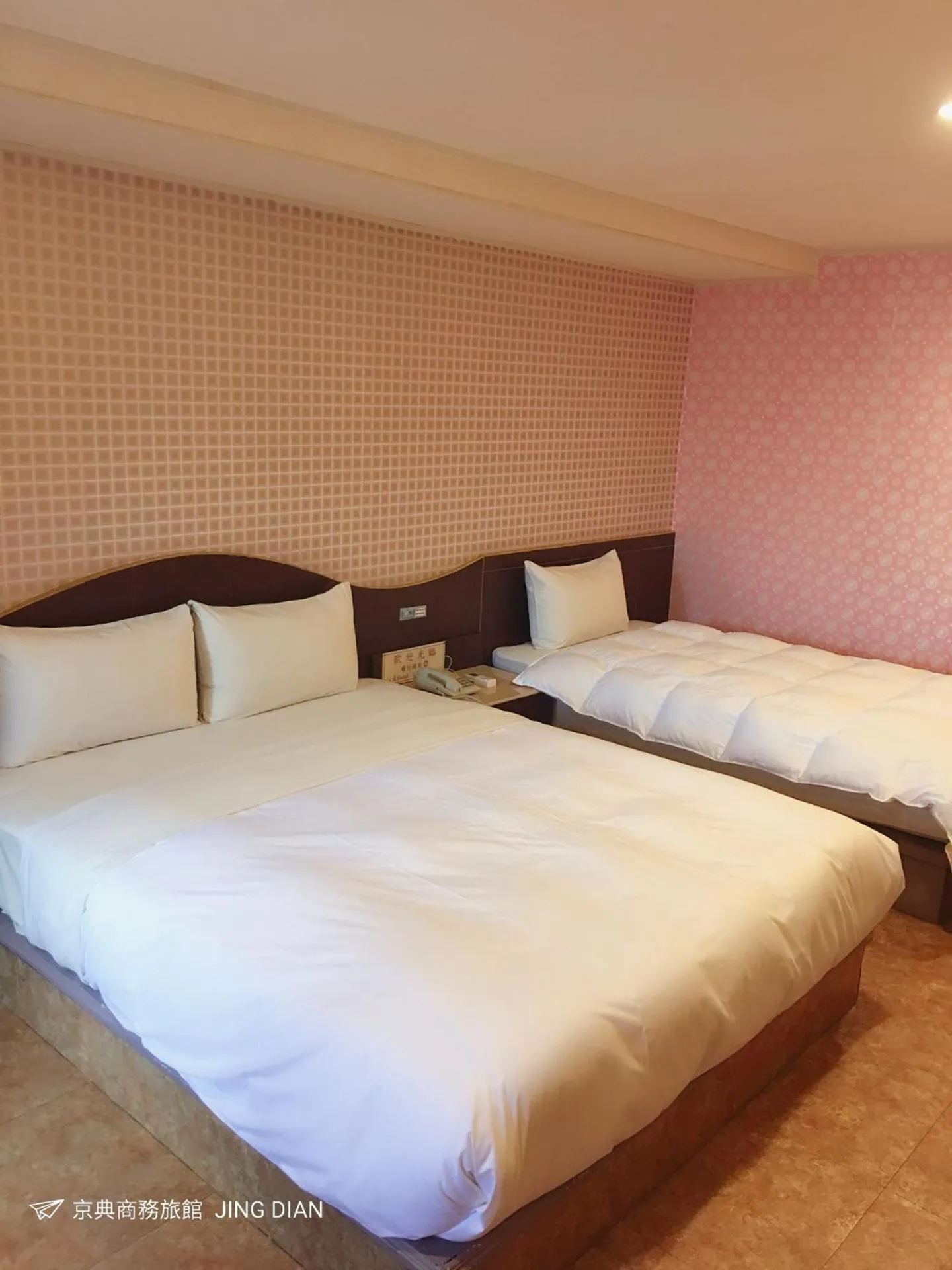 Bed in Jing Dian Business Hotel