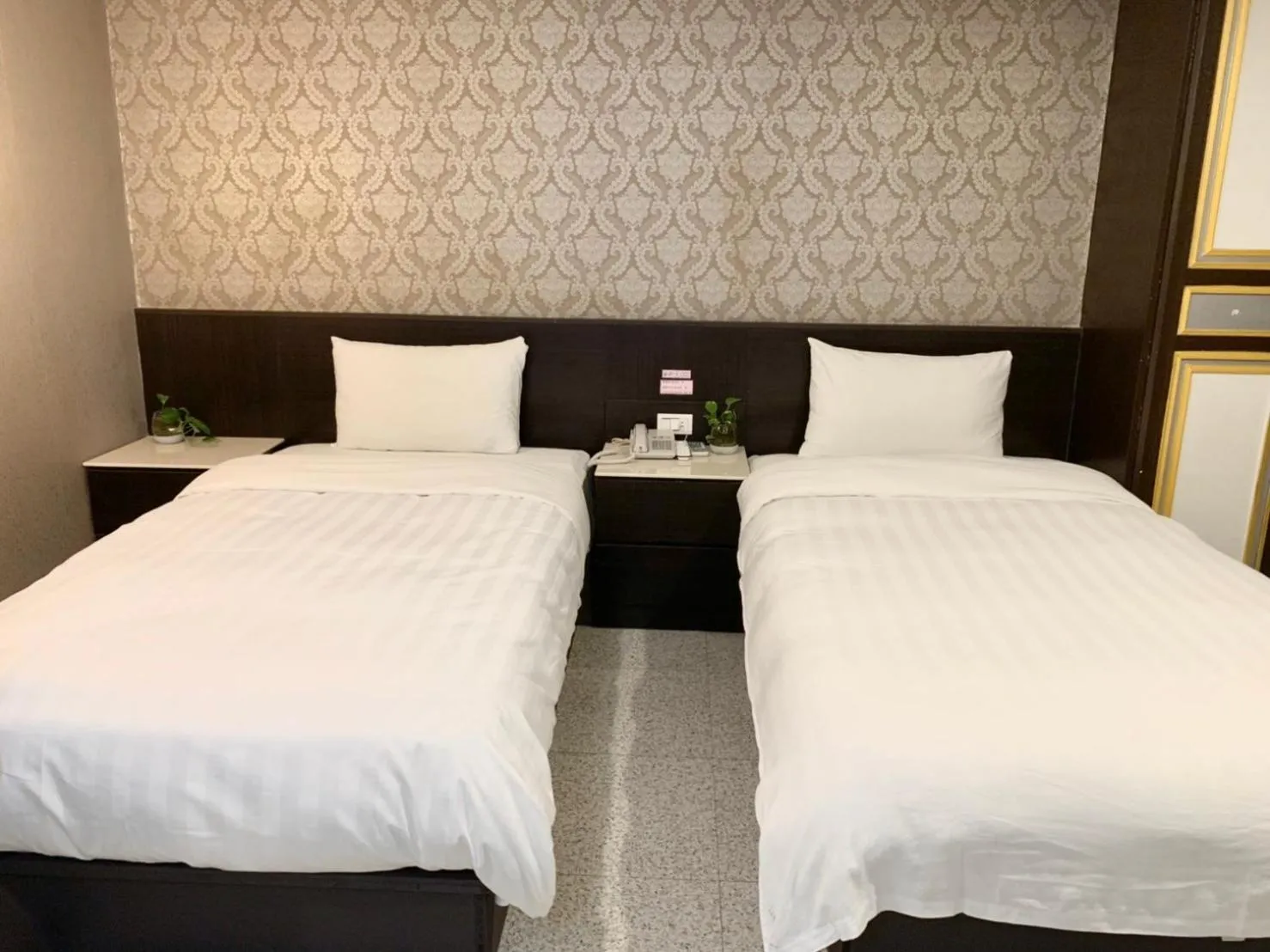 Bed in Jing Dian Business Hotel