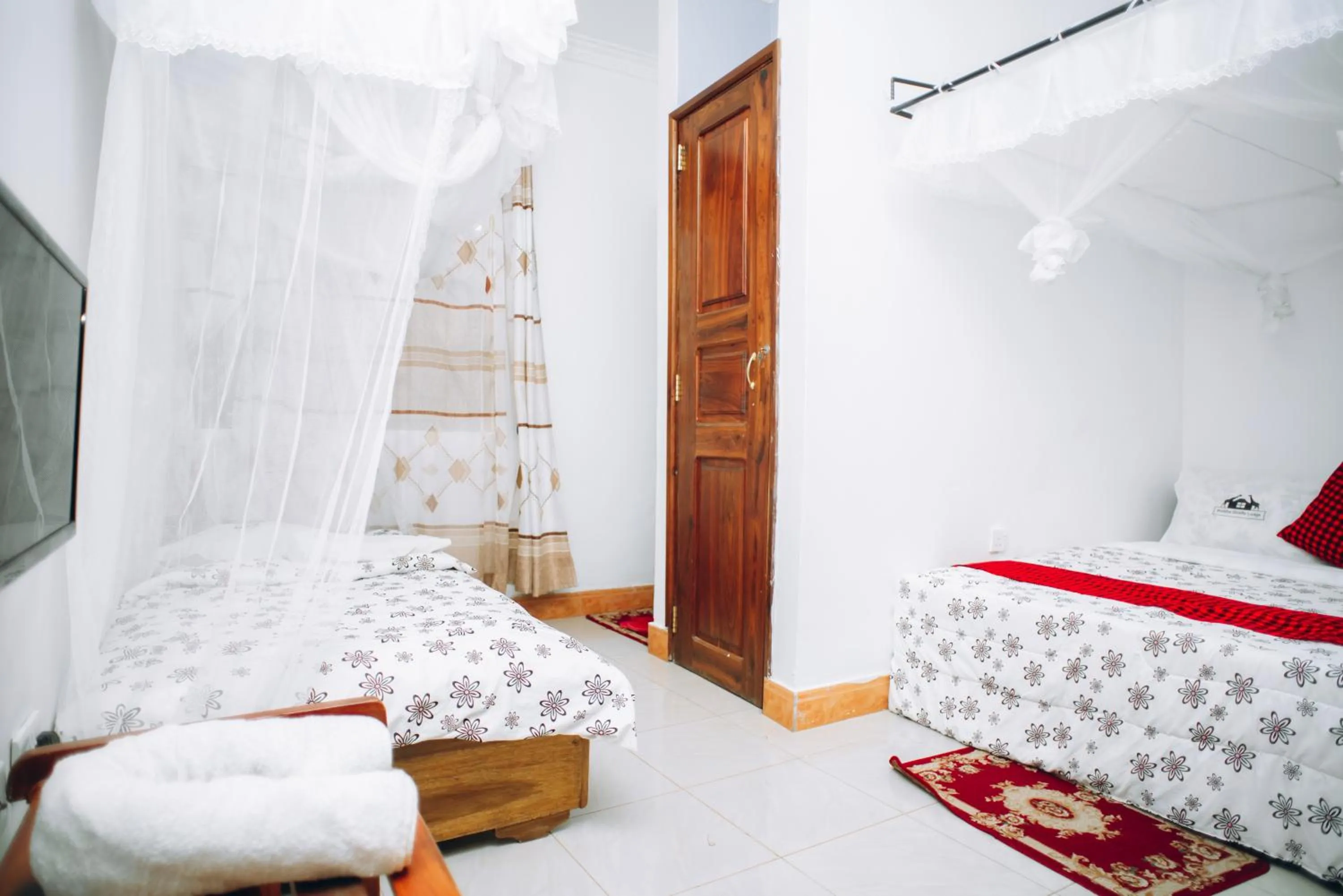 Bed in Arusha Giraffe Lodge