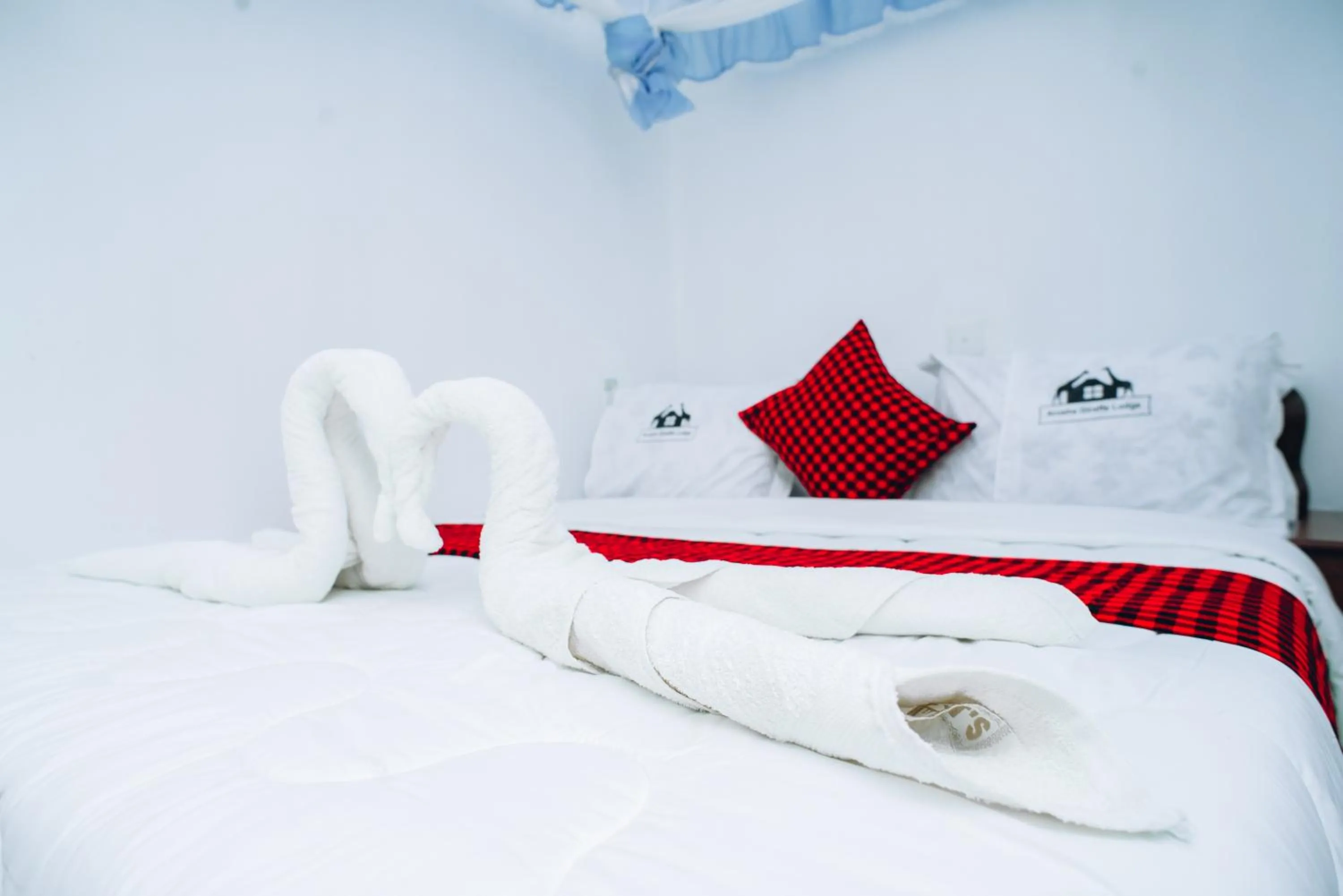 Bed in Arusha Giraffe Lodge