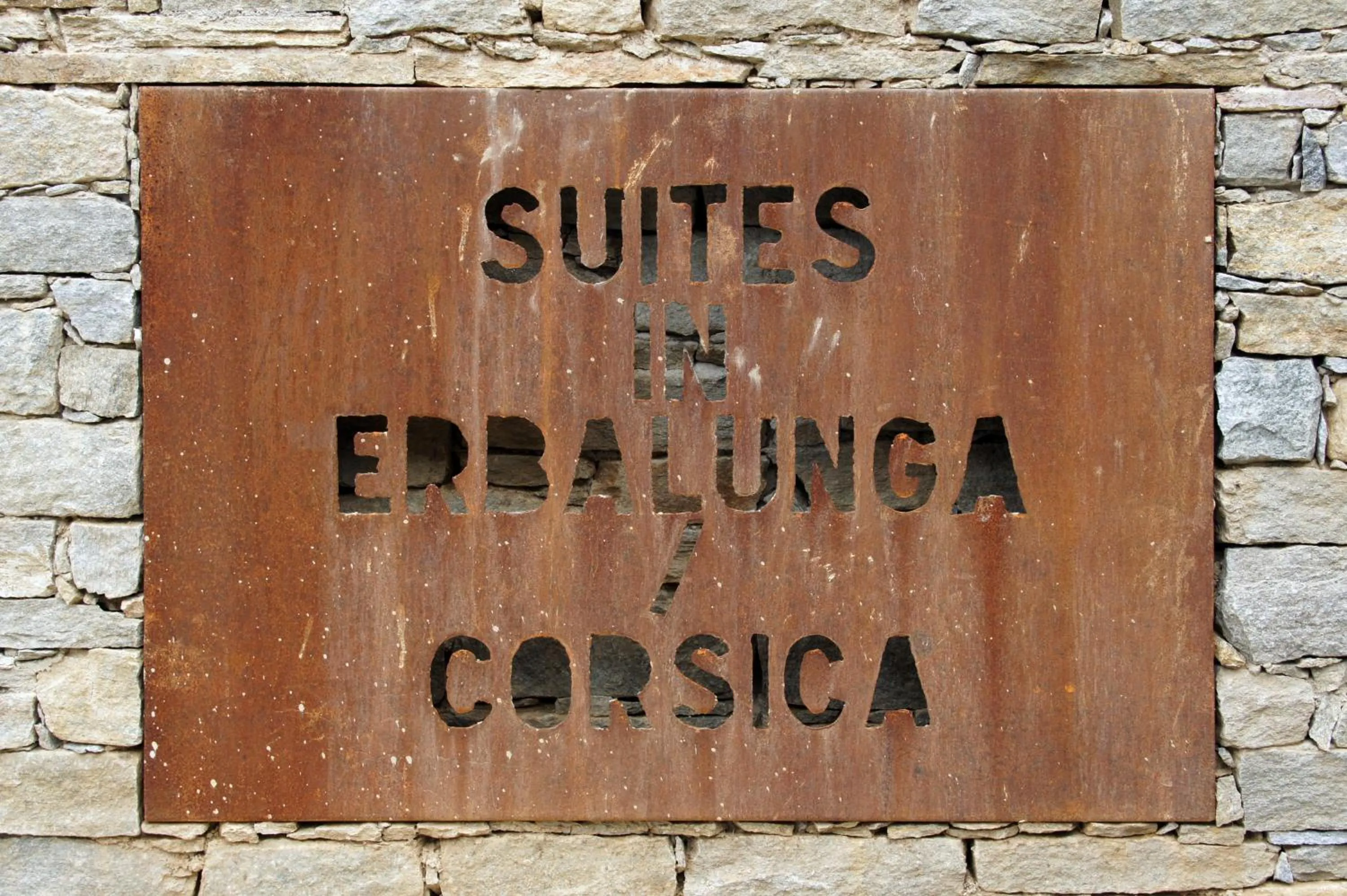Property logo or sign in Suites in Erbalunga