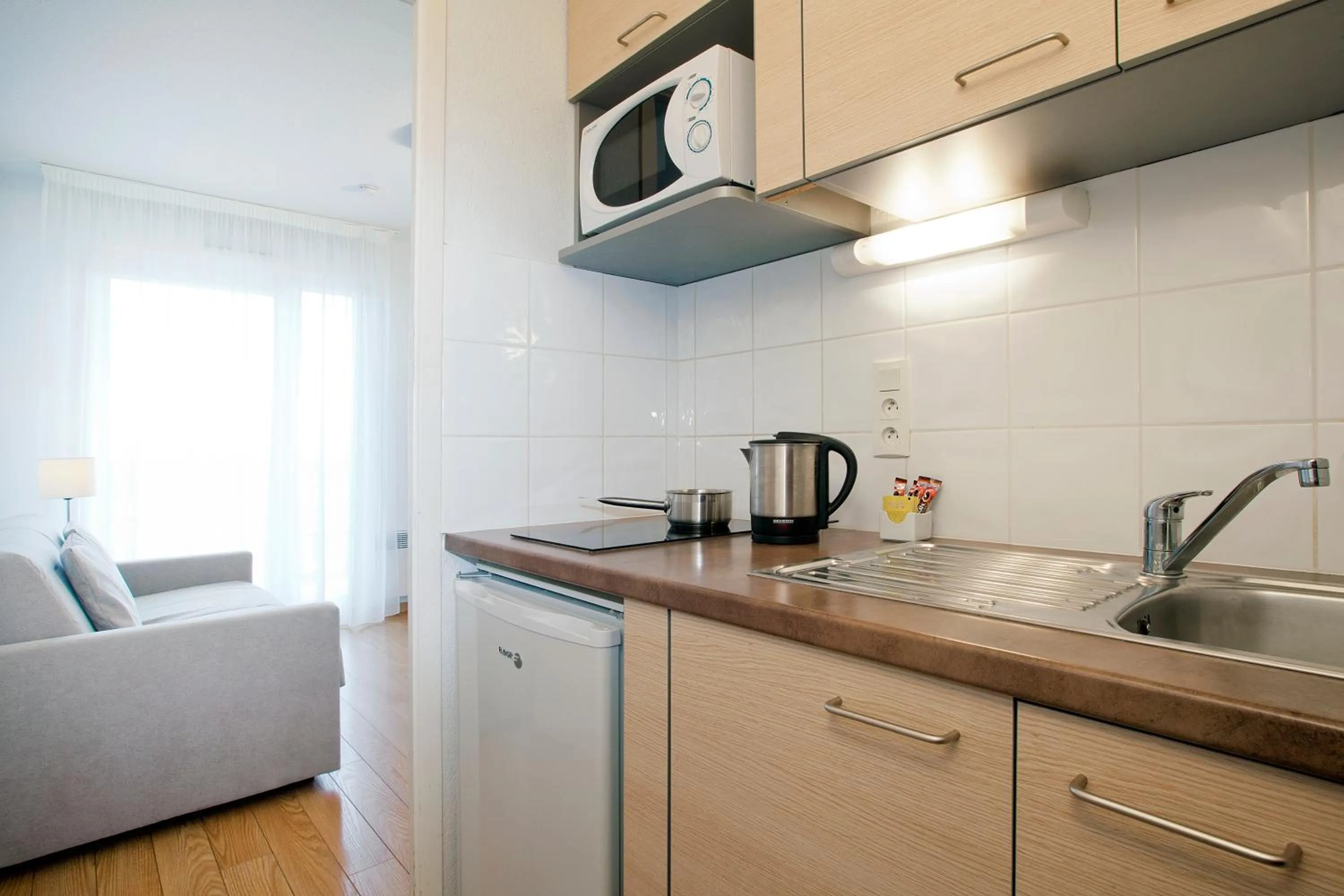 Kitchen or kitchenette in Séjours & Affaires Genève Gex Les Rives Du Léman