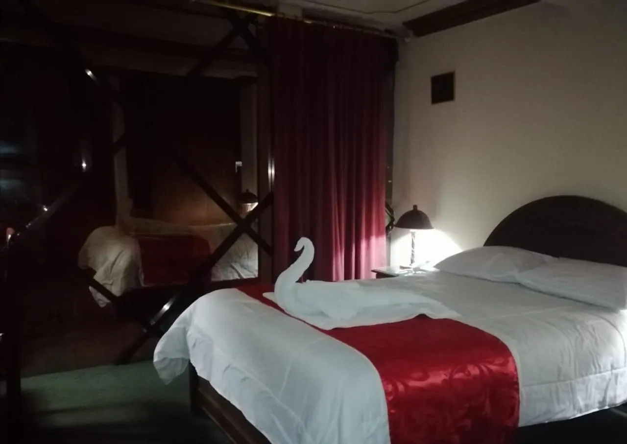 Bed in Hotel Alexander