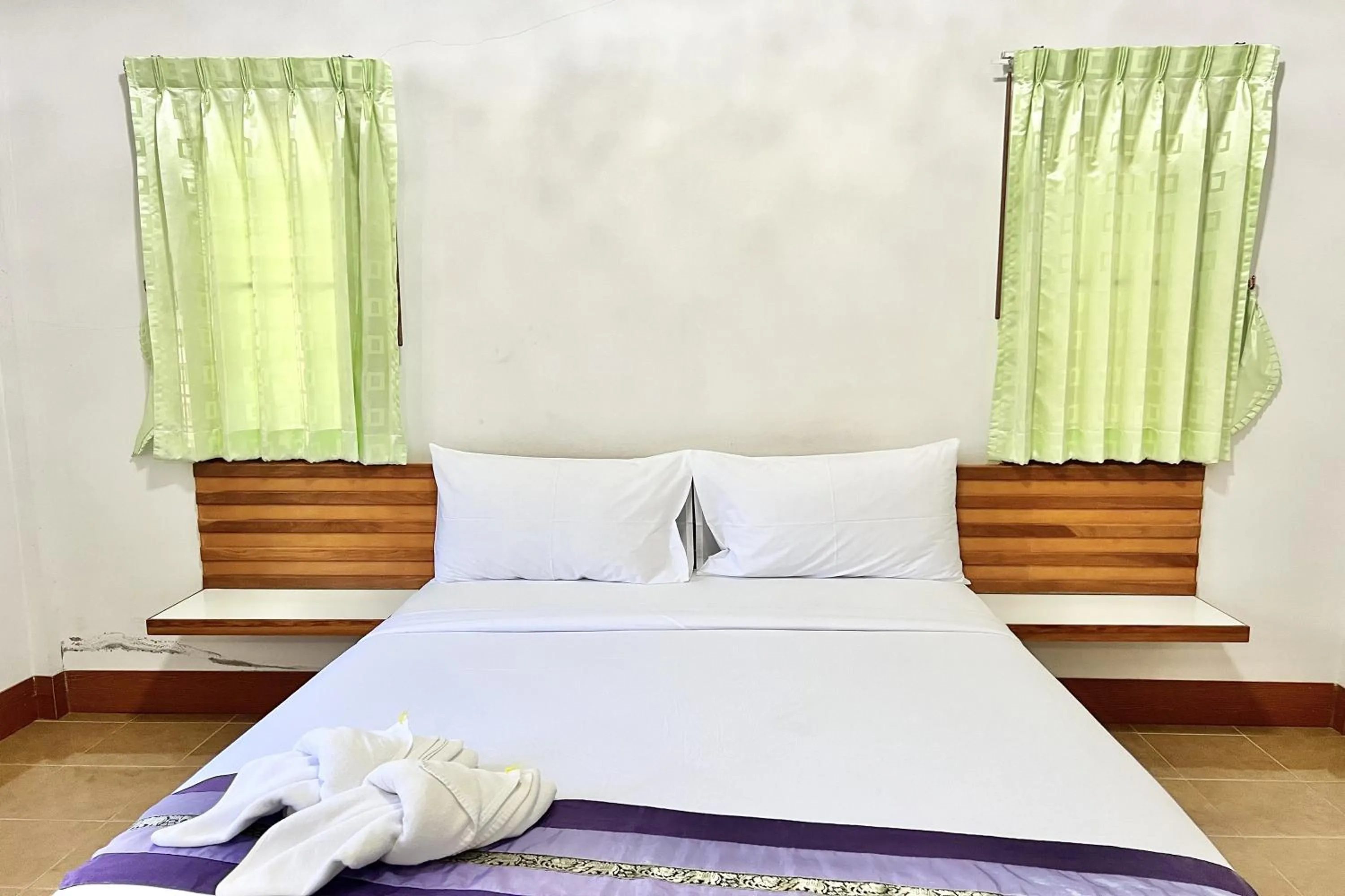 Bed in Ruentara Resort & Villa